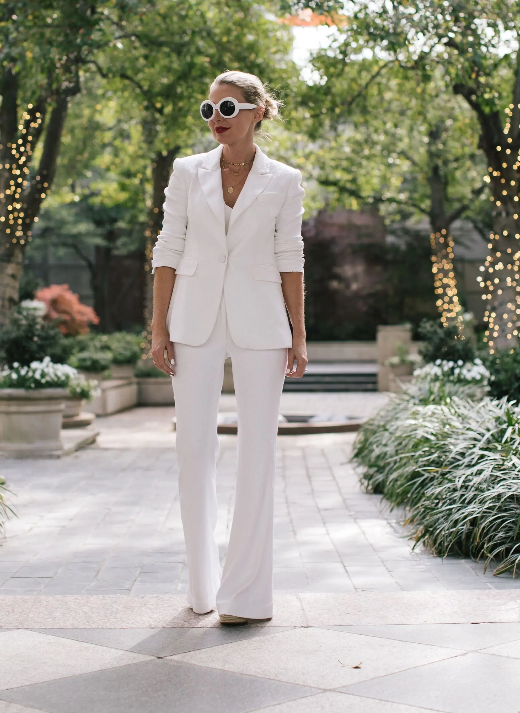 Perfect White Suit, Fashion blogger Erin Busbee of BusbeeStyle.com wearing a matching white sequin blazer and wide leg pants by Rachel Zoe, white pointed toe pumps, and a white chloe nile bag in Dallas, Texas