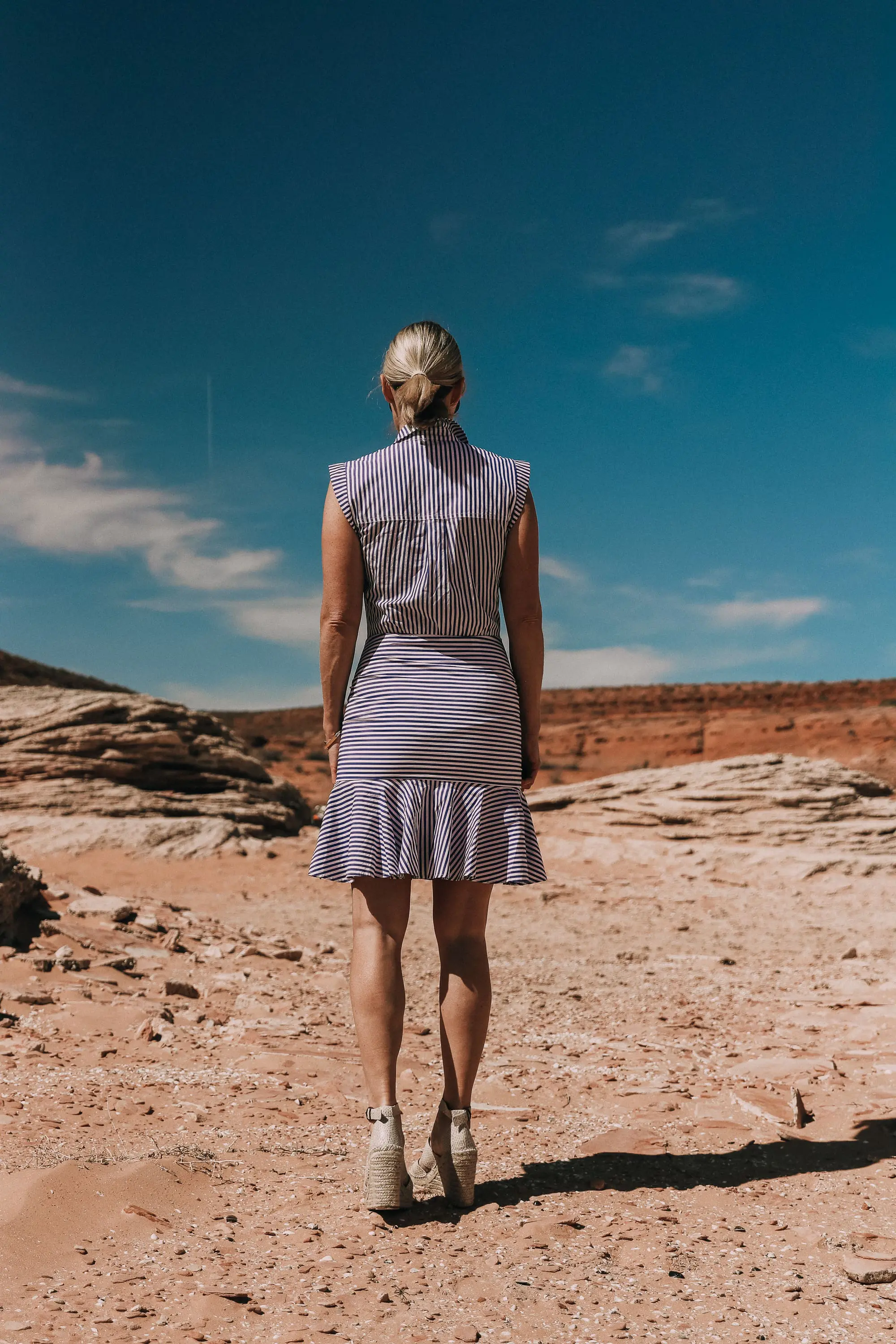 back of veronica beard bell button down blue and white striped dress work by fashion blogger in lake powell