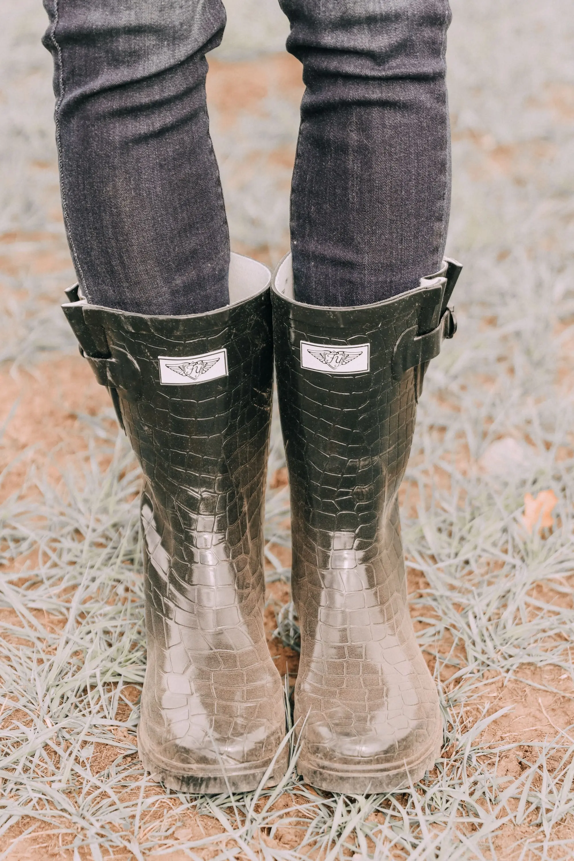 walmart croc rubber rain boots paired with dark wash ankle skinny jeans 