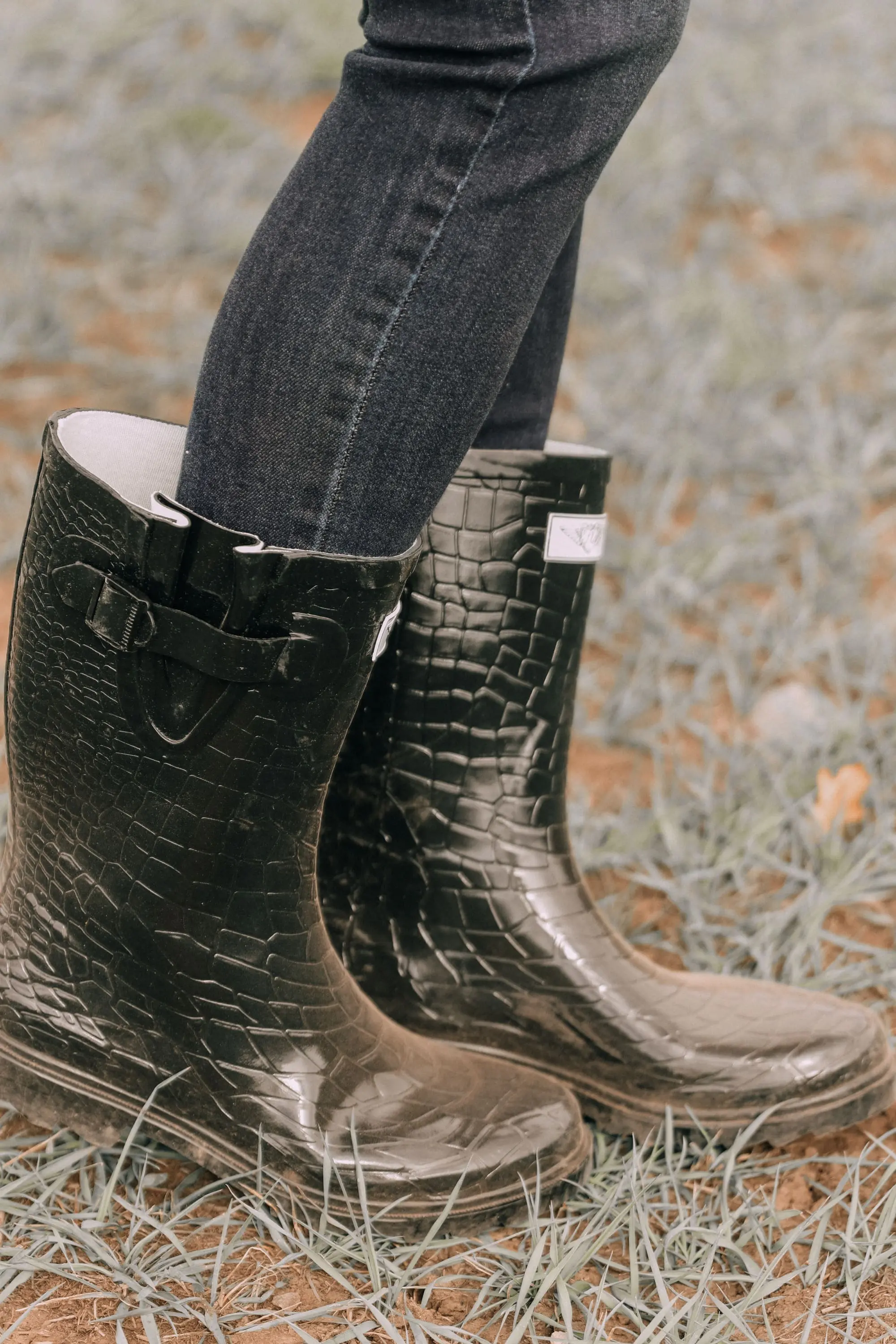sideview of walmart croc rubber rain boots paired with dark wash ankle skinny jeans 