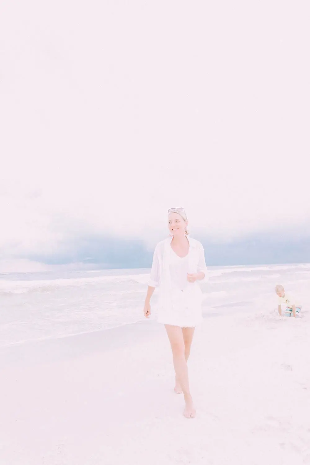 Skorts, Fashion blogger Erin Busbee of BusbeeStyle.com wearing a white denim skort fro Revolve with a Madewell tee and Rails striped button down on the beach in Florida
