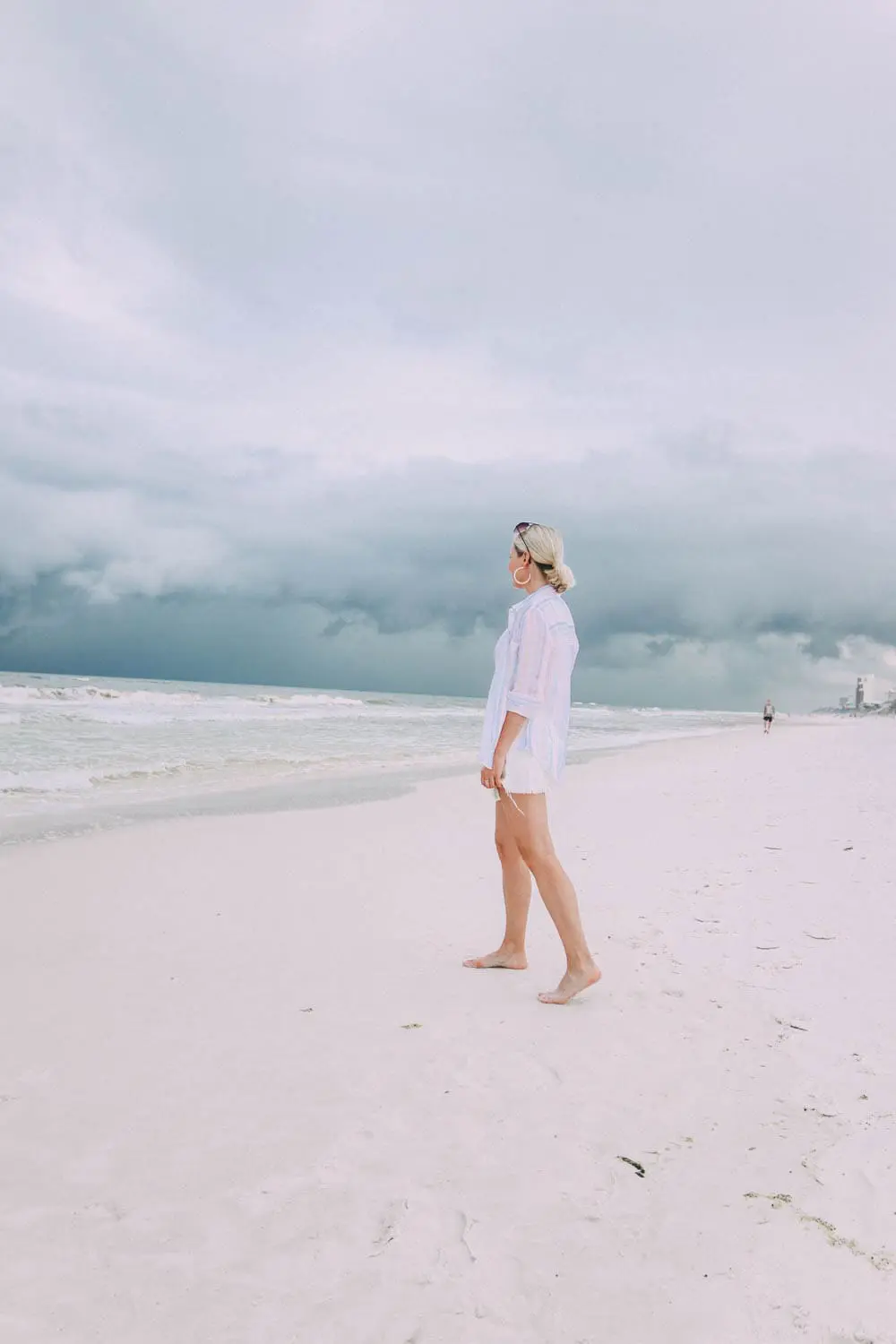 Skorts, Fashion blogger Erin Busbee of BusbeeStyle.com wearing a white denim skort fro Revolve with a Madewell tee and Rails striped button down on the beach in Florida