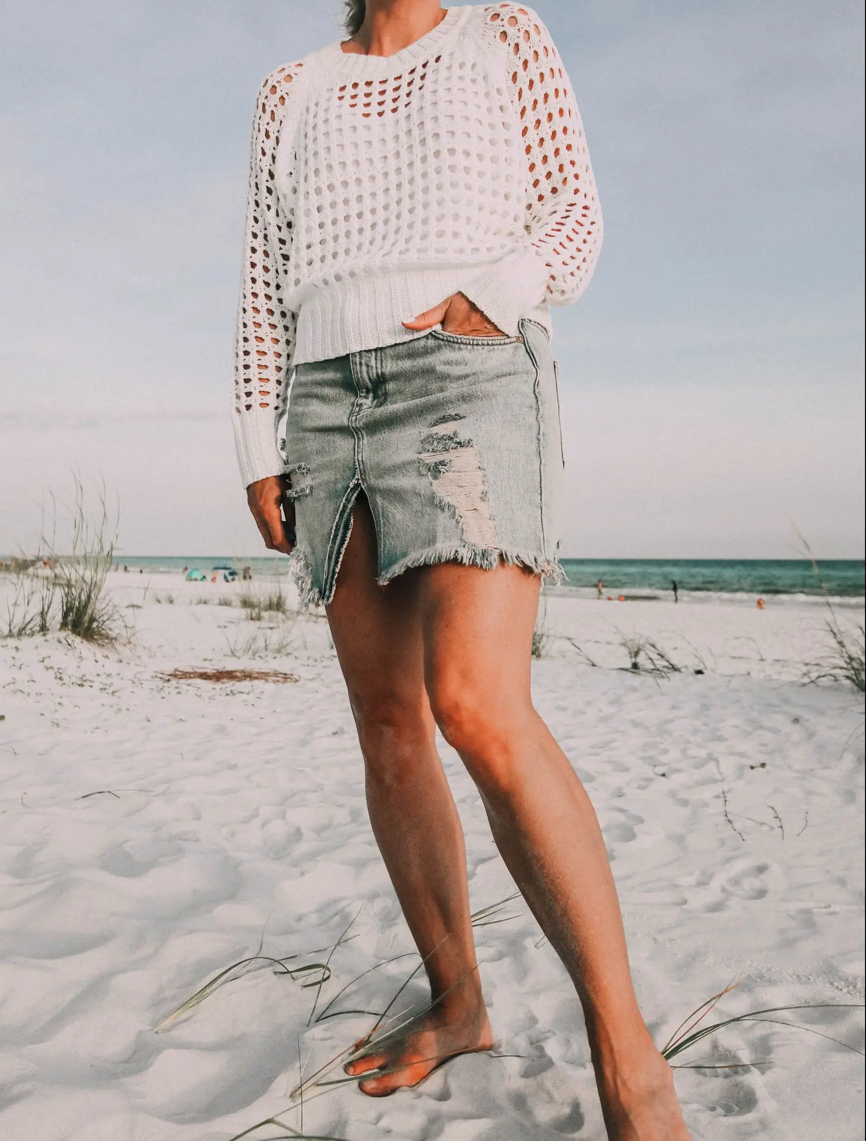 Denim Skirts, Fashion blogger Erin Busbee of BusbeeStyle.com wearing a denim skirt by Free People with a white knit sweater from Nordstrom on the beach in Florida