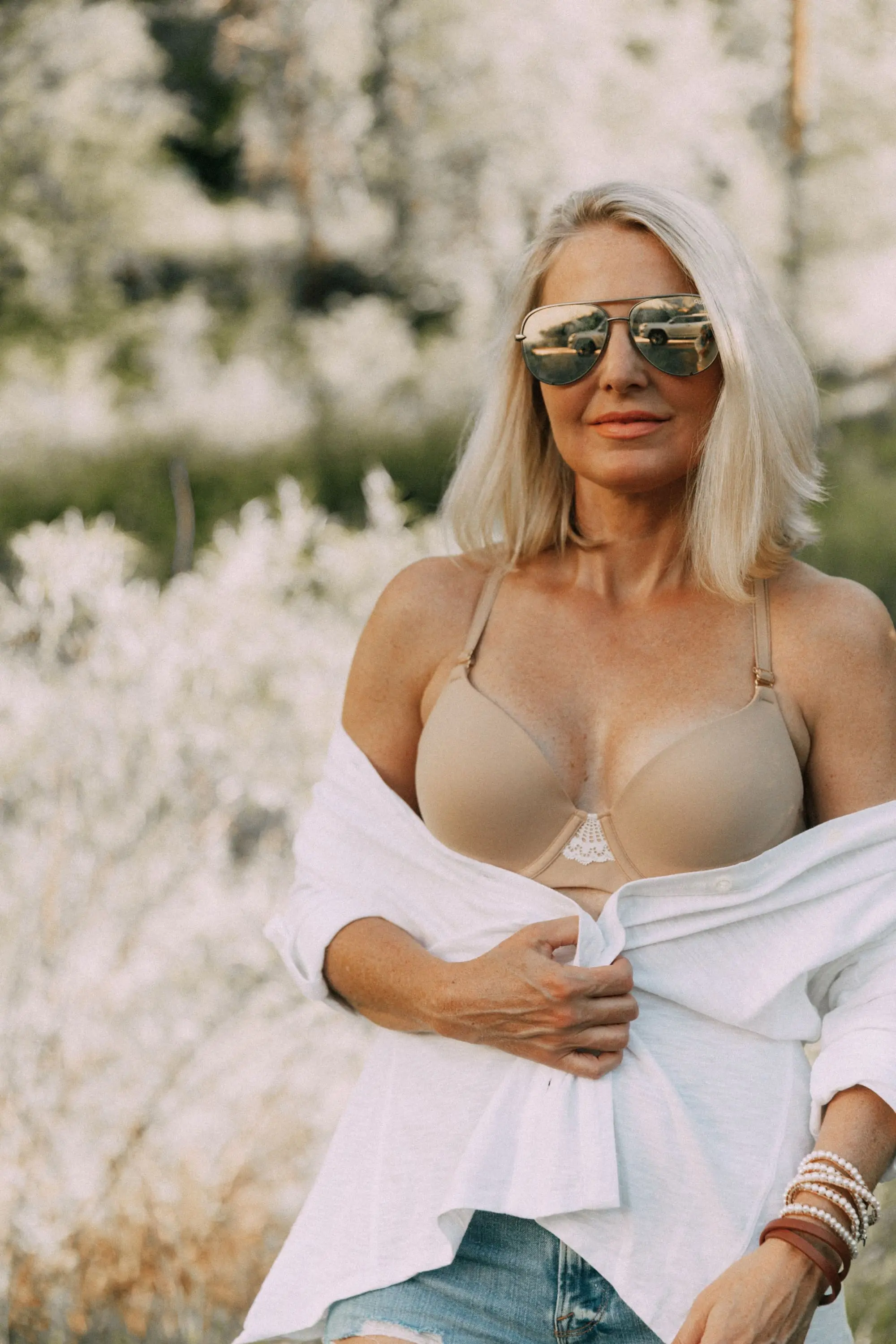 Racerback Bra, Fashion blogger Erin Busbee of BusbeeStyle.com wearing a racerback bra under a white button up tunic from Soma in Telluride, CO