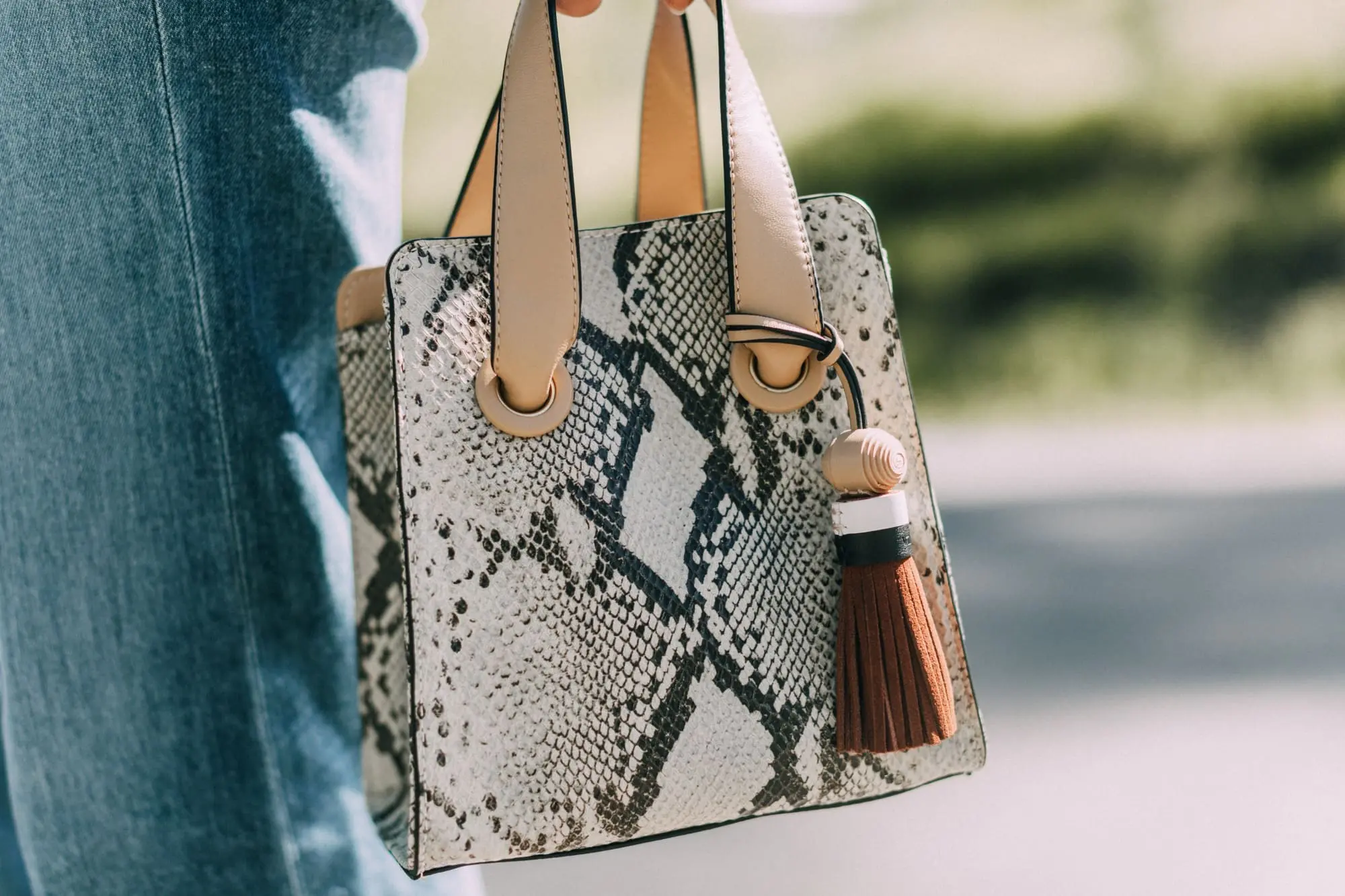 Lucite Trend, Fashion blogger Erin Busbee of BusbeeStyle.com wearing lucite mules from Vince Camuto with J Brand jeans, white Leith top, Hermes belt, and a python print Vince Camuto bag in Telluride, Colorado