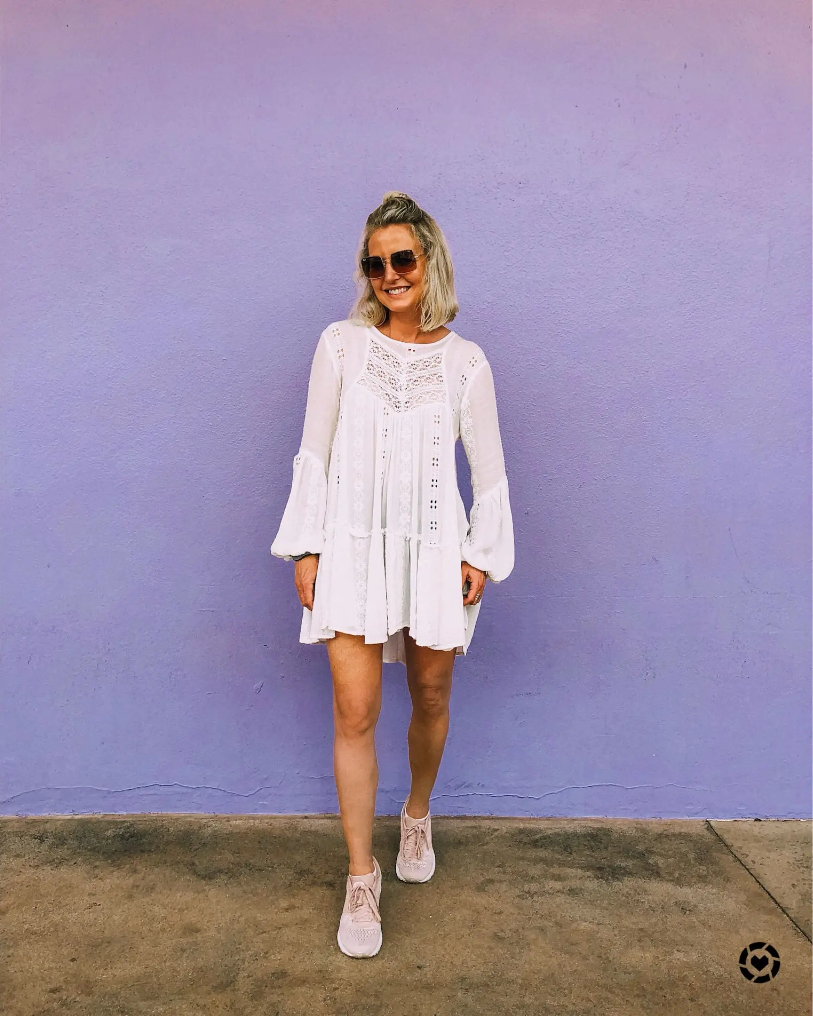 What I Wore At Disney, Fashion blogger Erin Busbee of BusbeeStyle.com wearing a Free People tunic top and denim shorts at Walt Disney World