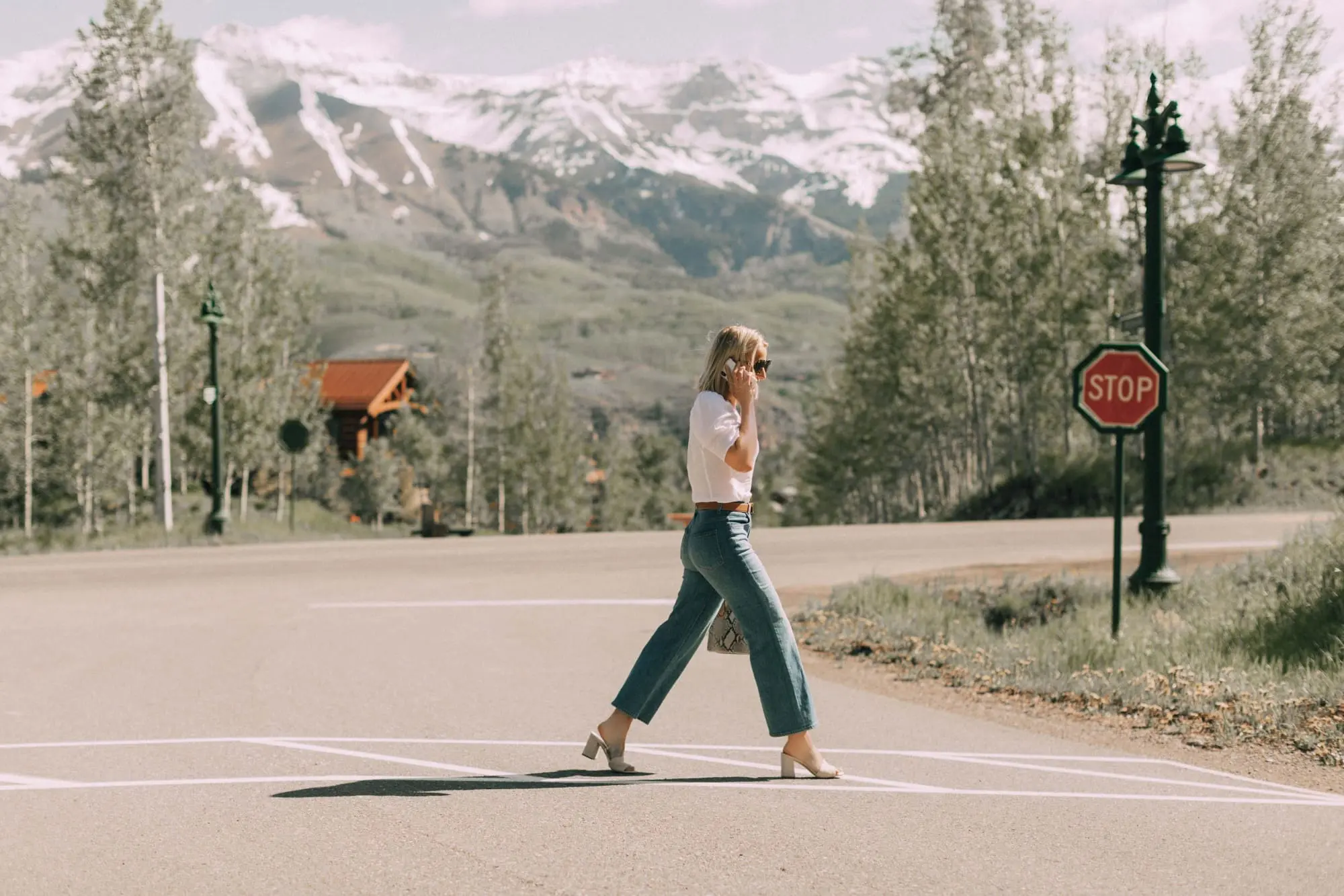 Lucite Trend, Fashion blogger Erin Busbee of BusbeeStyle.com wearing lucite mules from Vince Camuto with J Brand jeans, white Leith top, Hermes belt, and a python print Vince Camuto bag in Telluride, Colorado