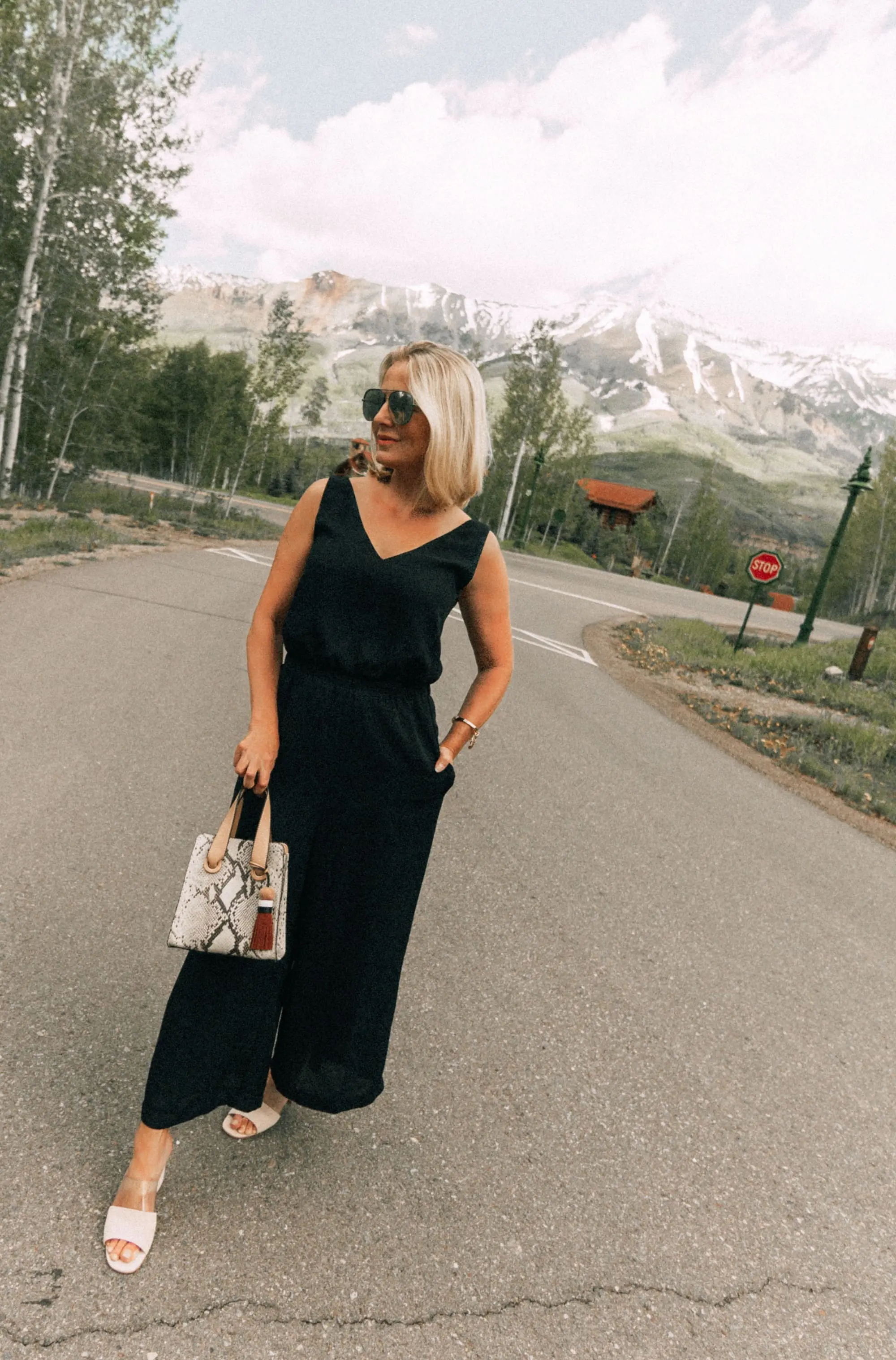Lucite Trend, Fashion blogger Erin Busbee of BusbeeStyle.com wearing lucite mules from Vince Camuto with J Brand jeans, white Leith top, Hermes belt, and a python print Vince Camuto bag in Telluride, Colorado
