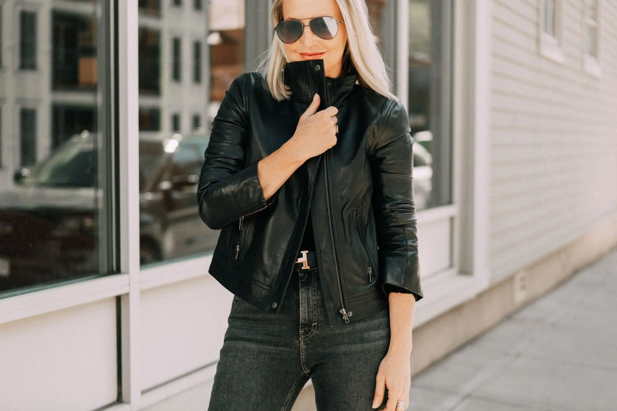 Leather Moto Jacket, Fashion blogger over 40 Erin Busbee of BusbeeStyle.com featuring the Chelsea28 black leather jacket from the Nordstrom Anniversary Sale 2019 styled with the velvet leopard bodysuit, Topshop jeans, and Charles Davidson python print booties from Nordstrom in Telluride, Colorado