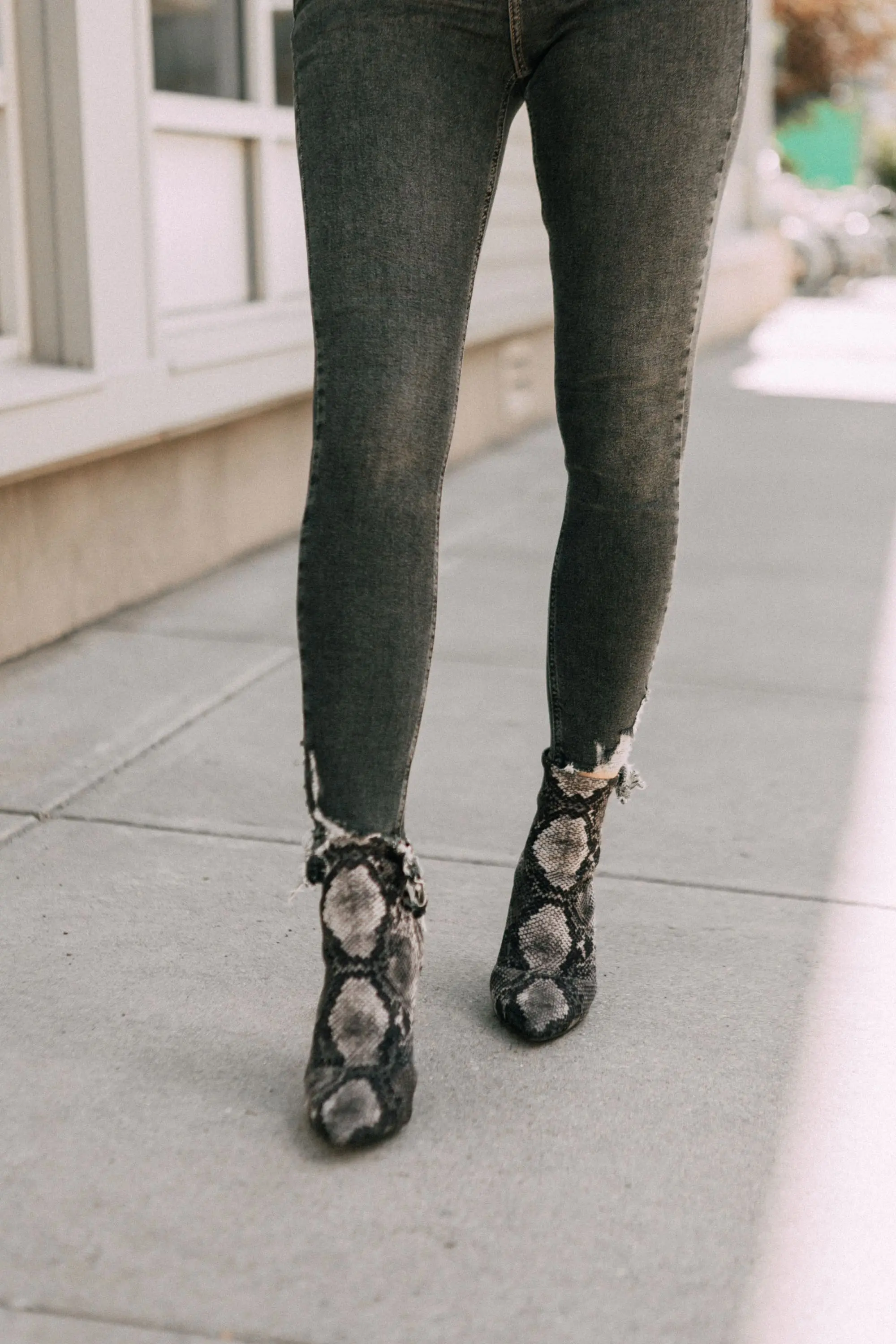 Leather Moto Jacket, Fashion blogger over 40 Erin Busbee of BusbeeStyle.com featuring the Chelsea28 black leather jacket from the Nordstrom Anniversary Sale 2019 styled with the velvet leopard bodysuit, Topshop jeans, and Charles Davidson python print booties from Nordstrom in Telluride, Colorado