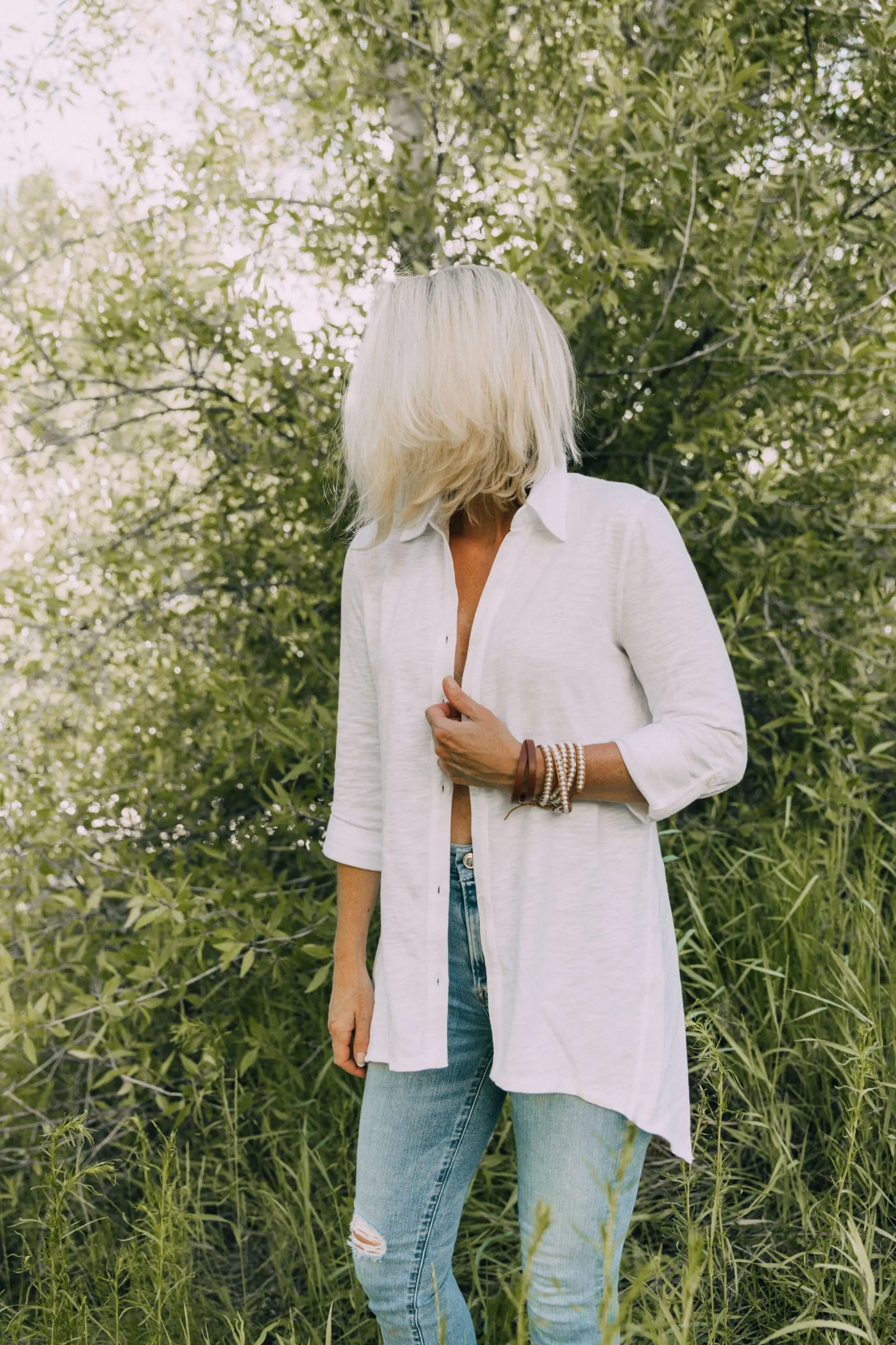 Racerback Bra, Fashion blogger Erin Busbee of BusbeeStyle.com wearing a racerback bra under a white button up tunic from Soma in Telluride, CO