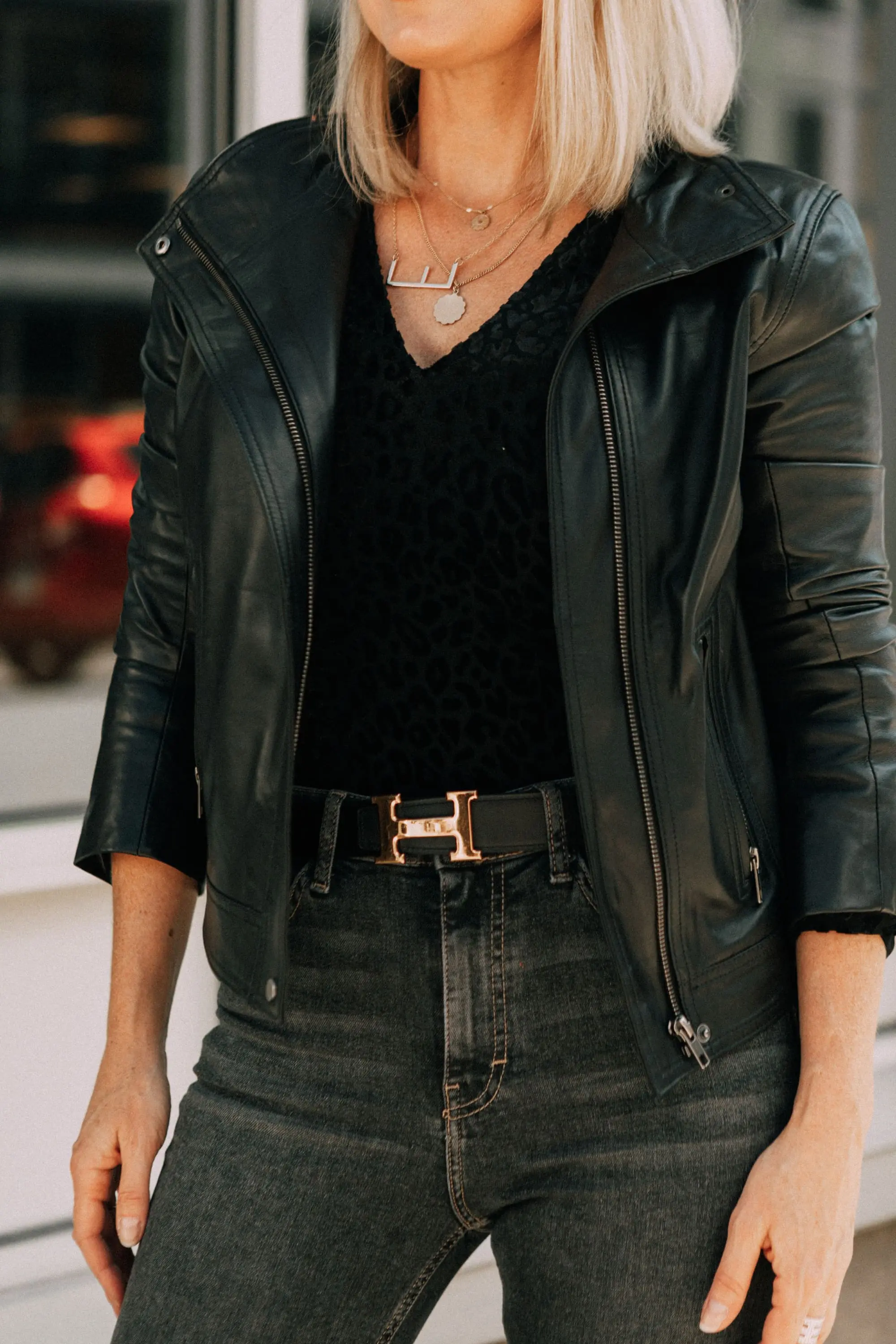 Leather Moto Jacket, Fashion blogger over 40 Erin Busbee of BusbeeStyle.com featuring the Chelsea28 black leather jacket from the Nordstrom Anniversary Sale 2019 styled with the velvet leopard bodysuit, Topshop jeans, and Charles Davidson python print booties from Nordstrom in Telluride, Colorado