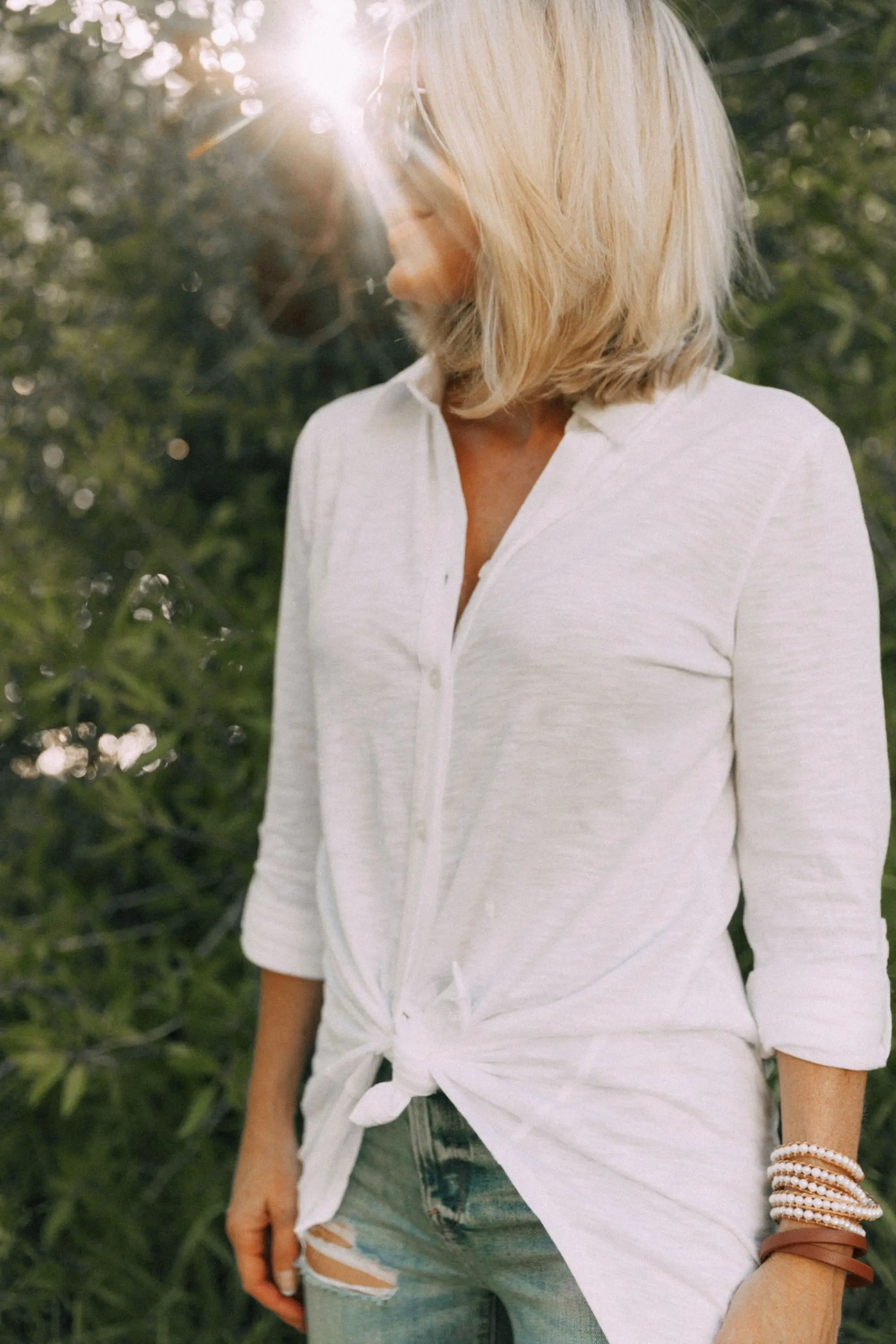 Racerback Bra, Fashion blogger Erin Busbee of BusbeeStyle.com wearing a racerback bra under a white button up tunic from Soma in Telluride, CO