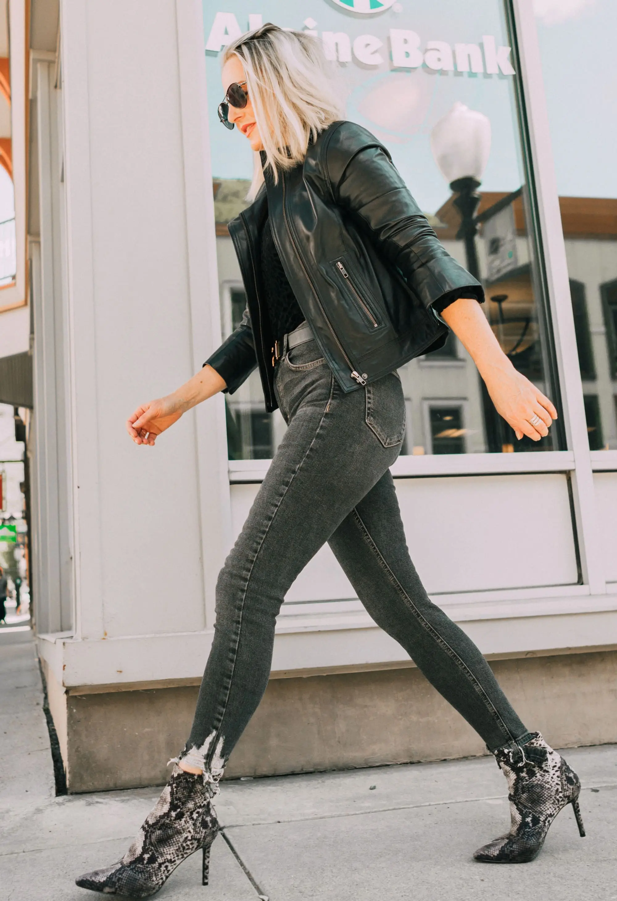 Leather Moto Jacket, Fashion blogger over 40 Erin Busbee of BusbeeStyle.com featuring the Chelsea28 black leather jacket from the Nordstrom Anniversary Sale 2019 styled with the velvet leopard bodysuit, Topshop jeans, and Charles Davidson python print booties from Nordstrom in Telluride, Colorado