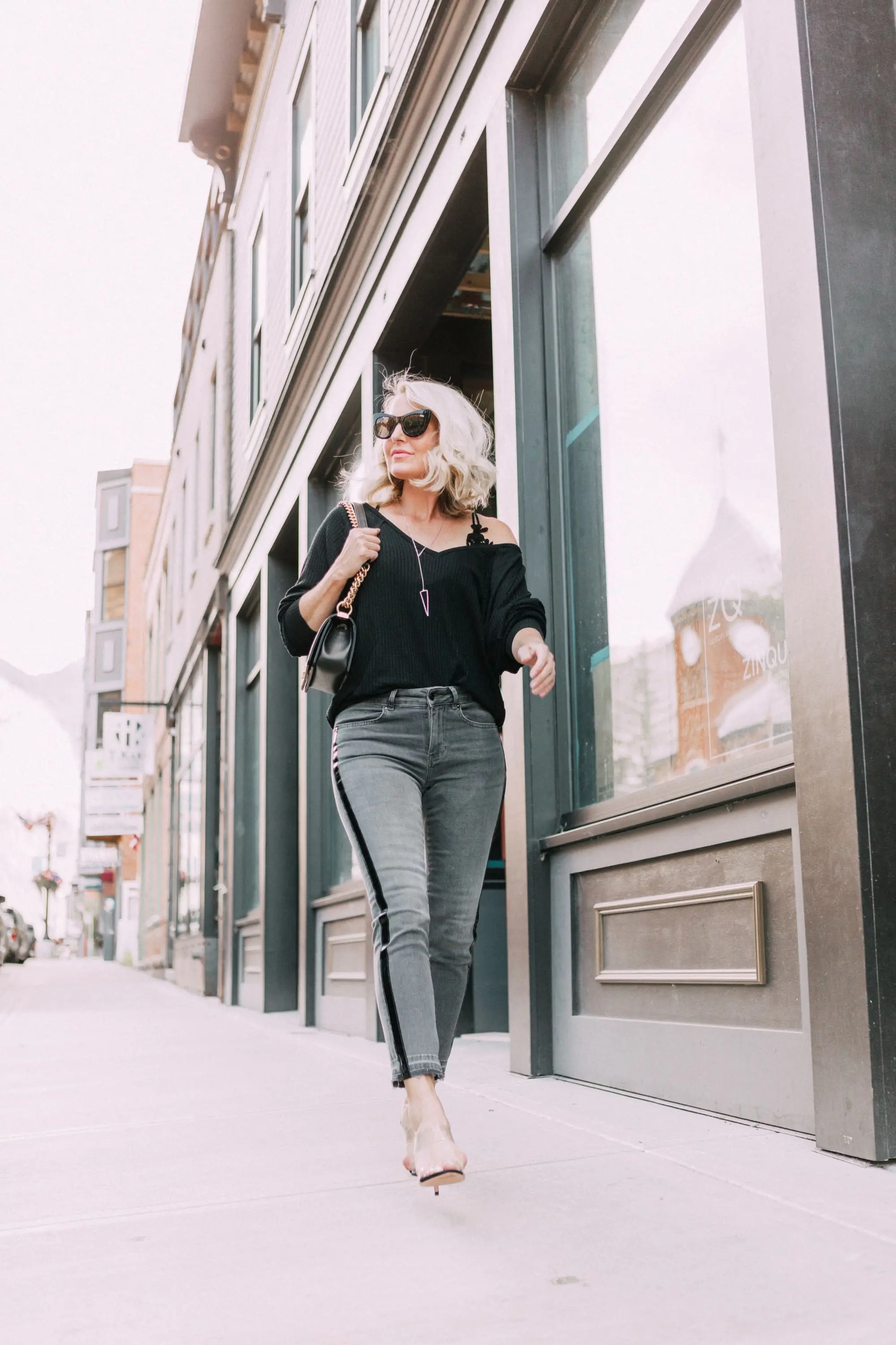 Striped Jeans, Fashion blogger Erin Busbee of BusbeeStyle.com wearing black patent striped jeans by Escada, waffle knit tee by Free People, bralette by Free People, heels by Schutz, and Chanel bag from Bloomingdale's in Telluride, CO
