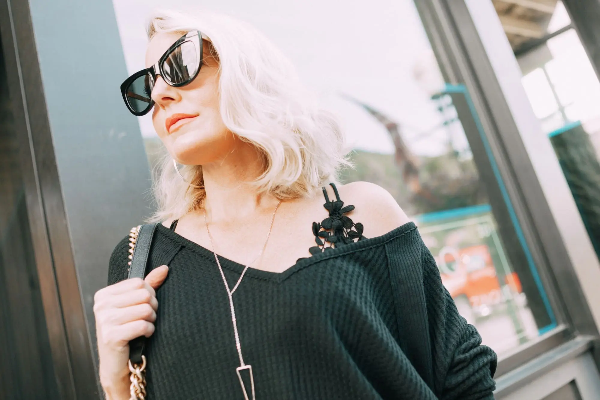 Striped Jeans, Fashion blogger Erin Busbee of BusbeeStyle.com wearing black patent striped jeans by Escada, waffle knit tee by Free People, bralette by Free People, heels by Schutz, and Chanel bag from Bloomingdale's in Telluride, CO