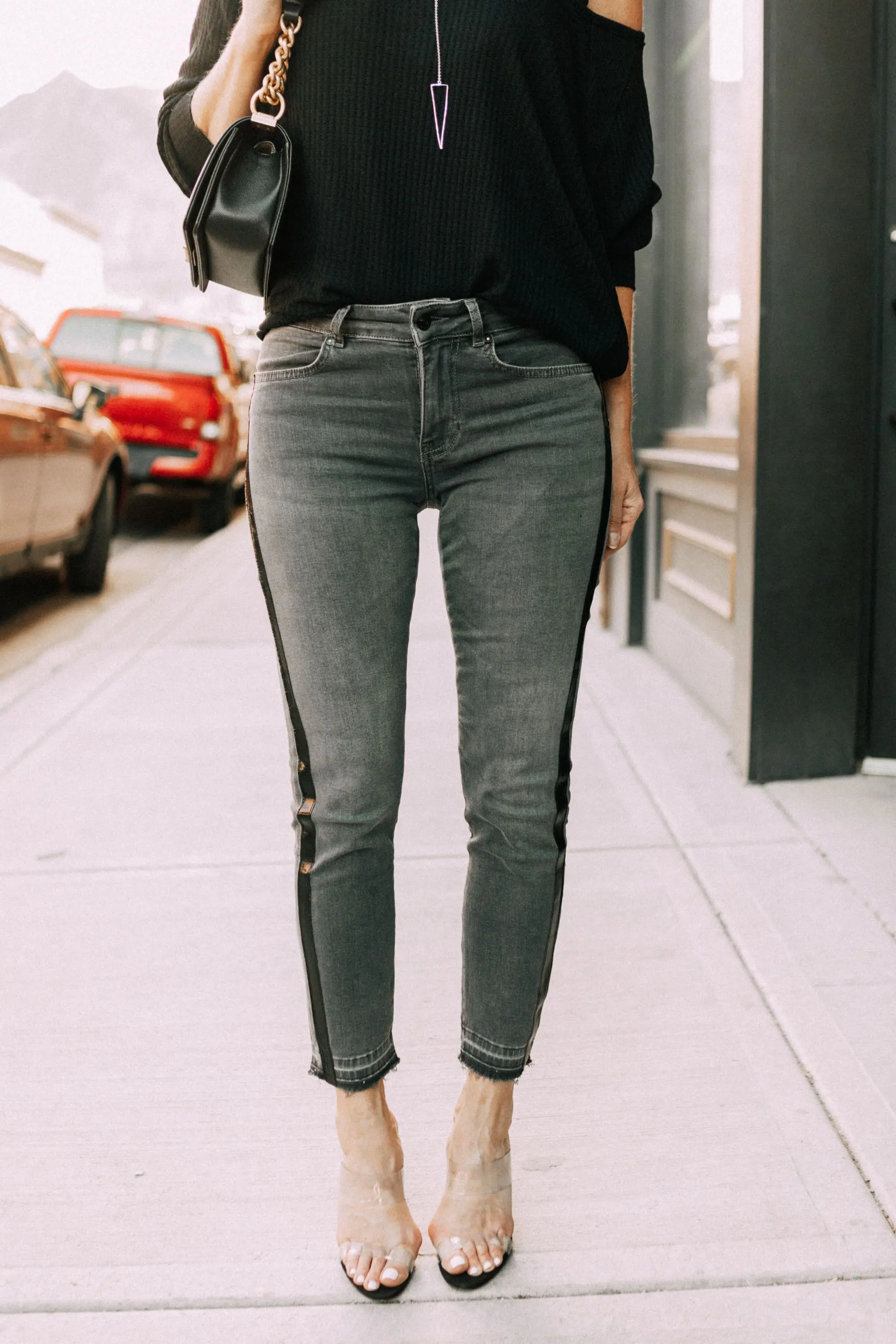Striped Jeans, Fashion blogger Erin Busbee of BusbeeStyle.com wearing black patent striped jeans by Escada, waffle knit tee by Free People, bralette by Free People, heels by Schutz, and Chanel bag from Bloomingdale's in Telluride, CO