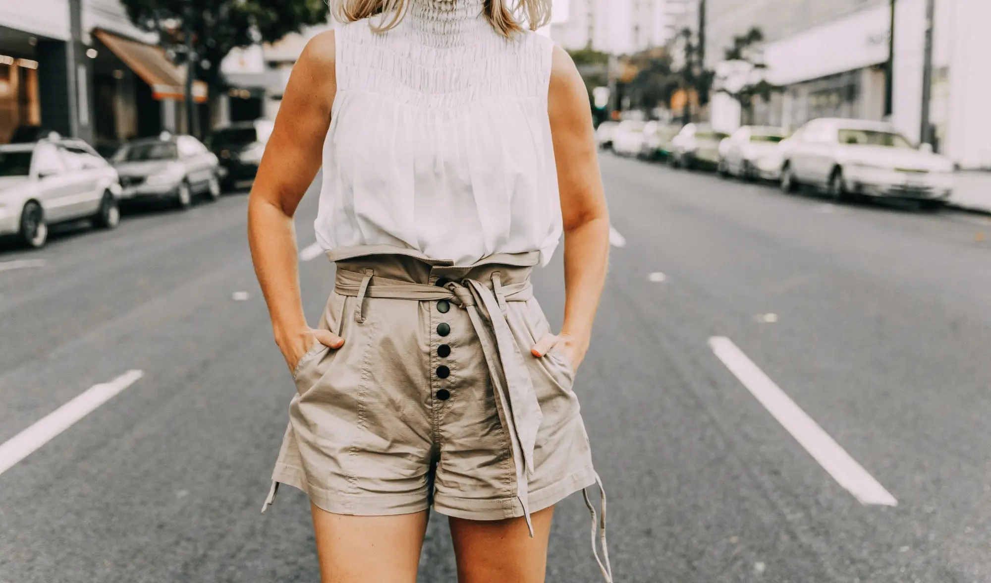 khaki paper bag shorts with tie waist paired with white top