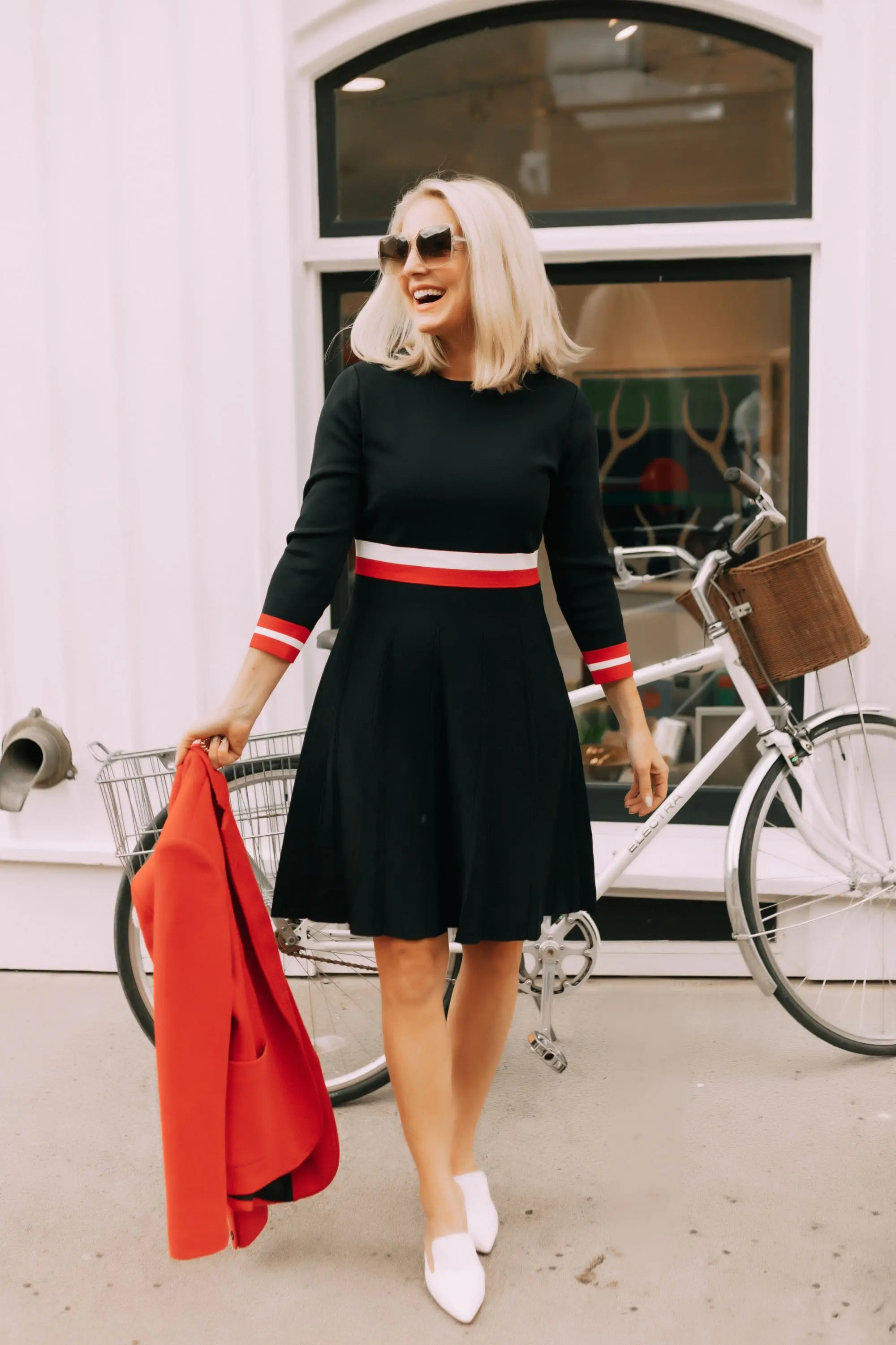 Colorful Office Outfits, Fashion blogger Erin Busbee of BusbeeStyle.com wearing a red knit blazer and navy striped fit and flare dress by Tommy Hilfiger in Telluride, CO