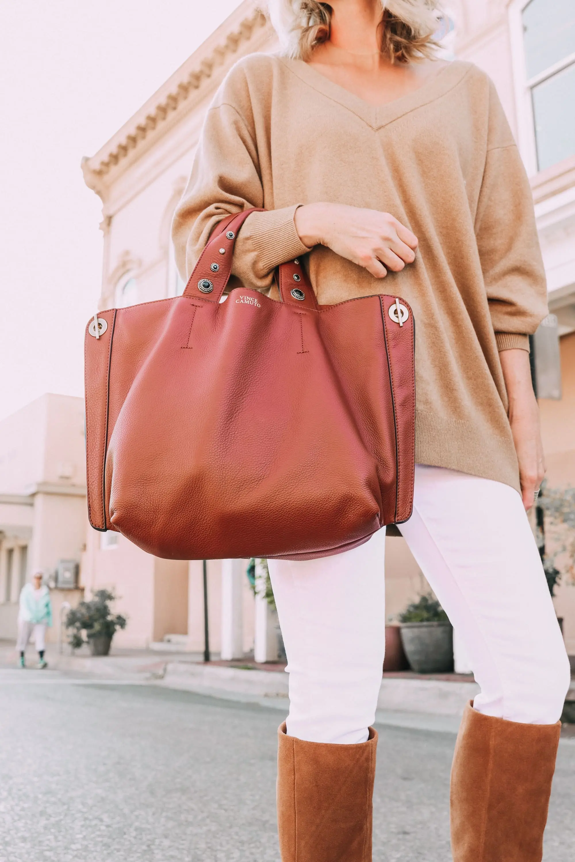 brown suede knee boots vince camuto modesie cone-heel boot fall autumn outfit with white jeans camel v-neck sweater