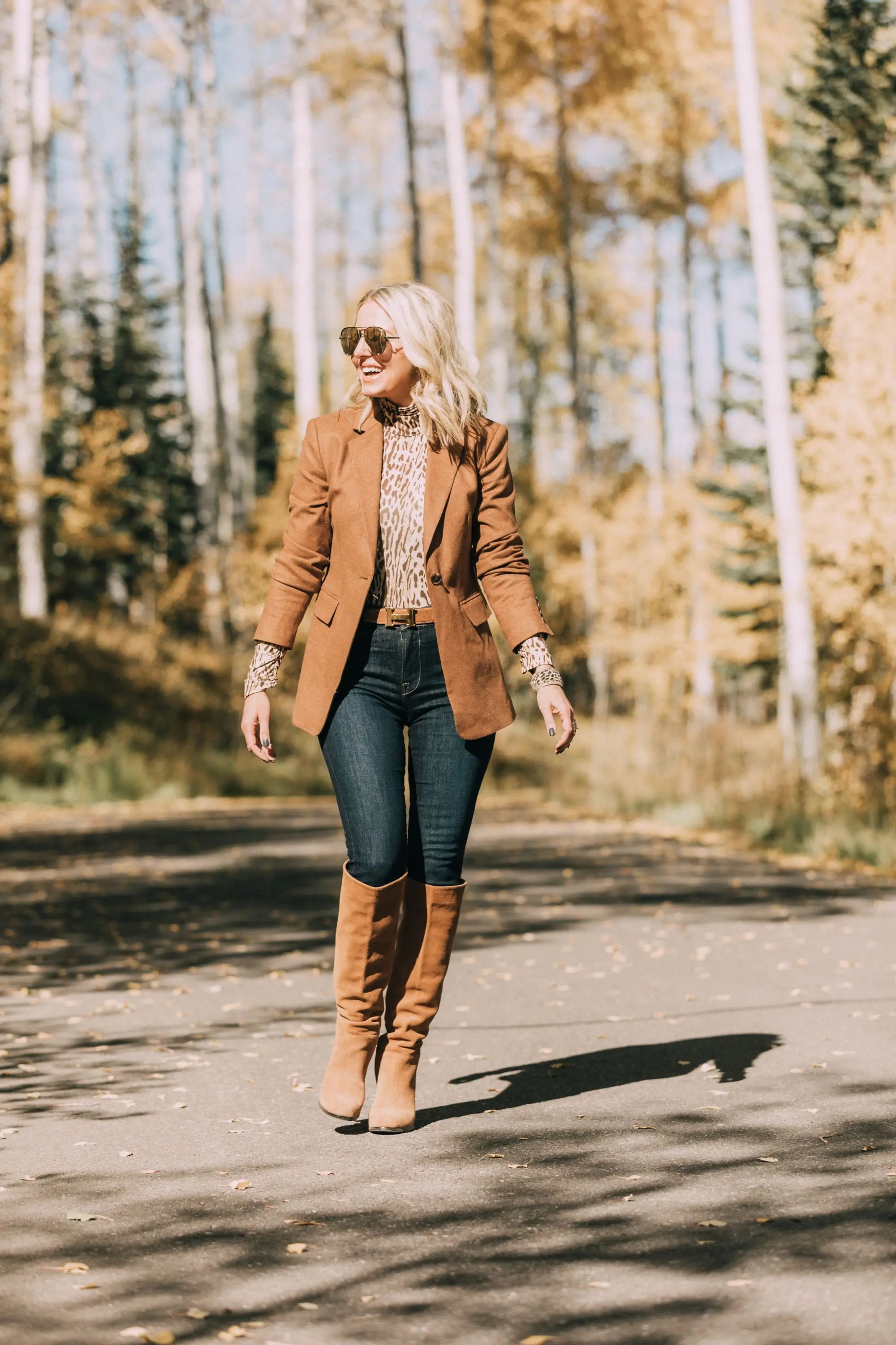 Neutral Fall Outfit, Fashion blogger Erin Busbee of BusbeeStyle.com wearing the camel brown Nordstrom signature blazer with a Zimmerman leopard print turtleneck, rag & bone skinny jeans, Sam Edelman knee high suede boots, and hermes belt in Telluride, CO