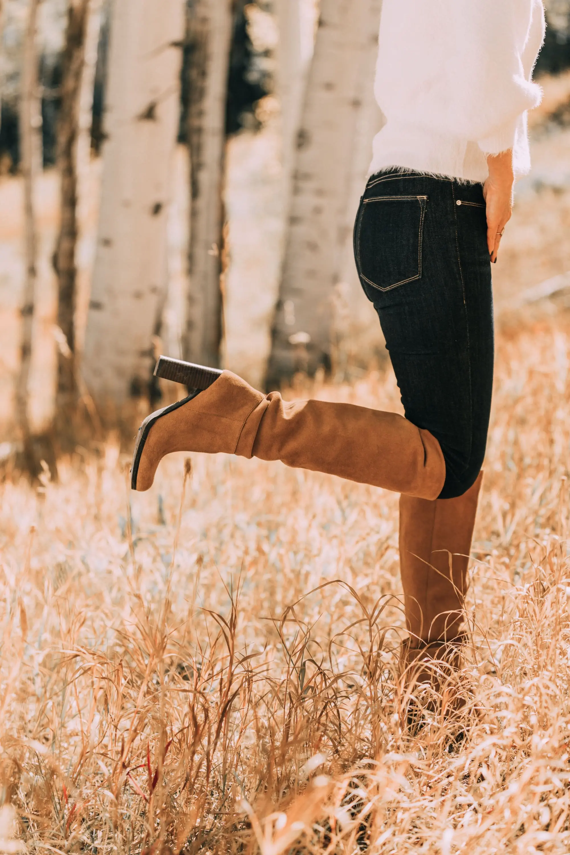 brown suede knee high boots worn with rag & bone skinny blue jeans white fuzzy line & dot sweater