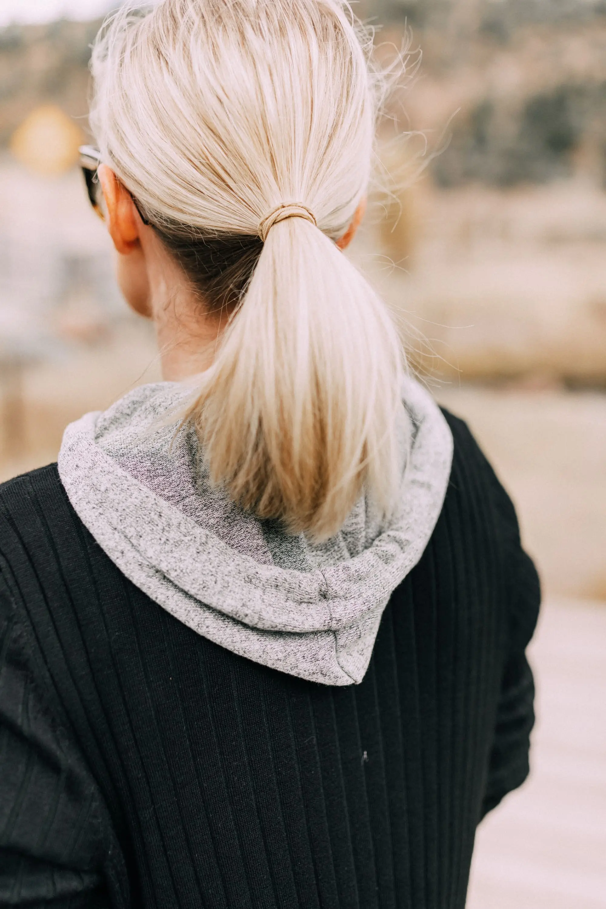fashion blogger busbee style wearing walmart black long cardigan sweater with gray hoodie underneath