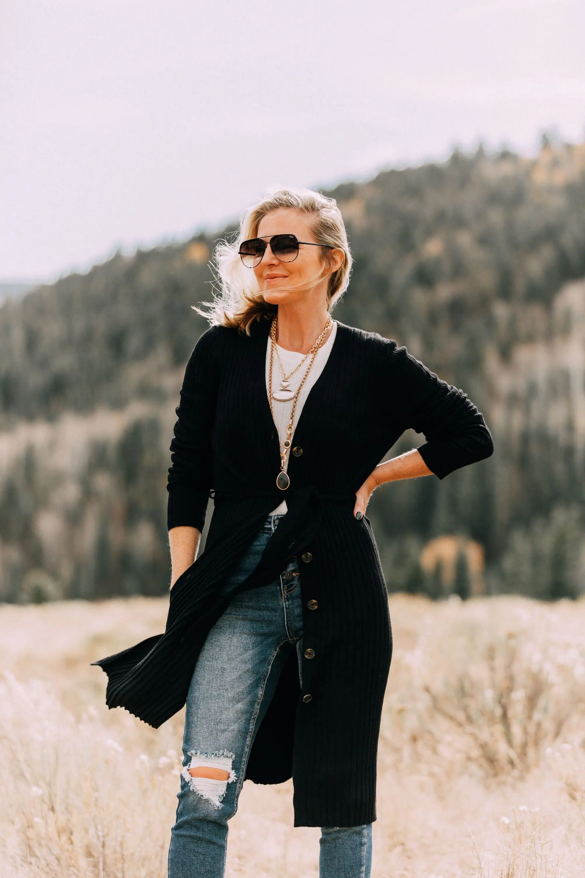 Long Cardigan outfit, Fashion blogger Busbee Style wearing Levi's ripped skinny jeans, Scoop Walmart snake embossed booties, white ribbed sweater, Walmart black ribbed long cardigan Telluride, CO