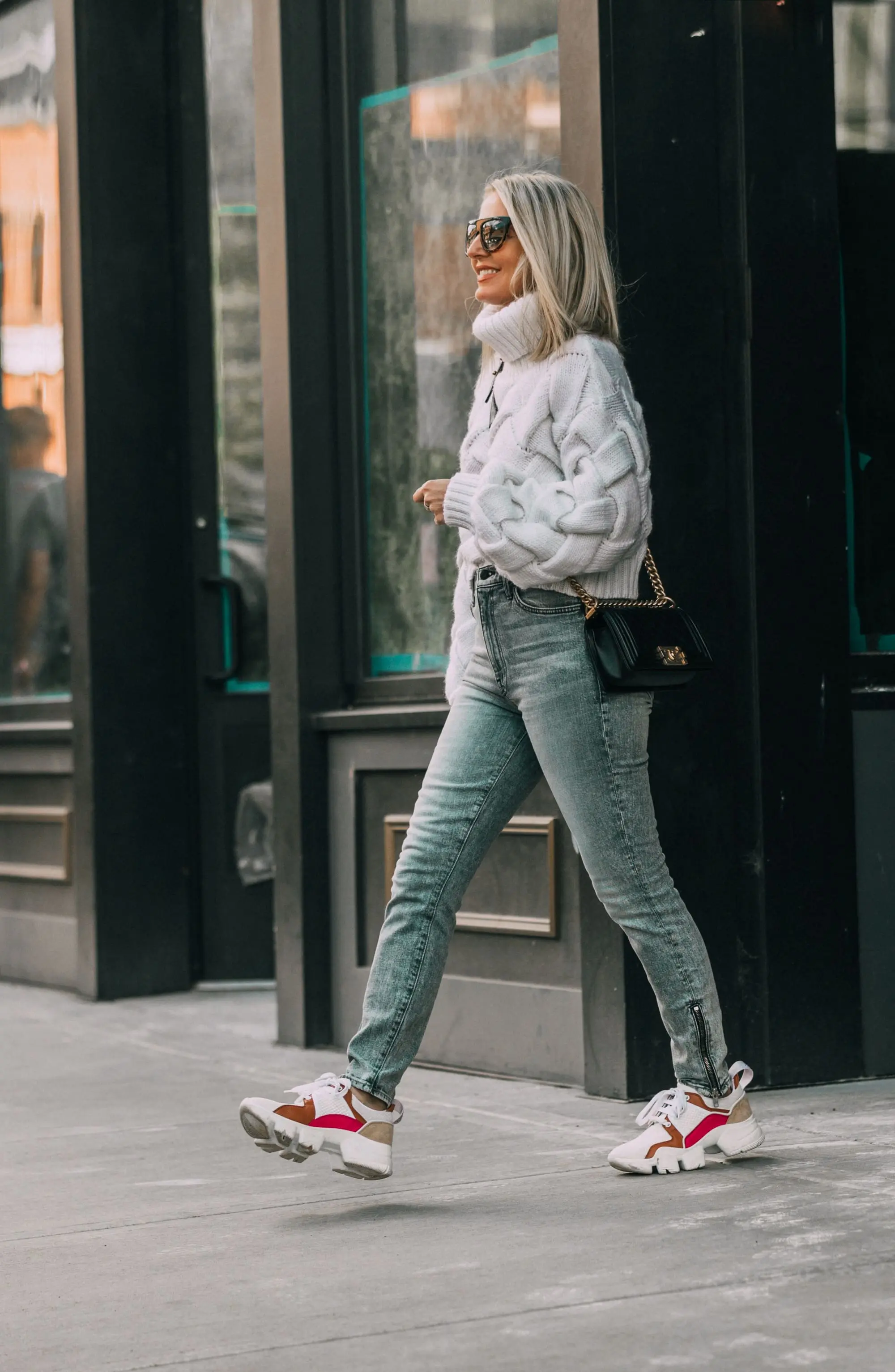 How To Style Dad Sneakers, Fashion blogger Erin Busbee of BusbeeStyle.com wearing designer dad sneakers with Mother ankle zip jeans, Lovers + Friends white sweater, and Chanel Boy Bag in Telluride, CO