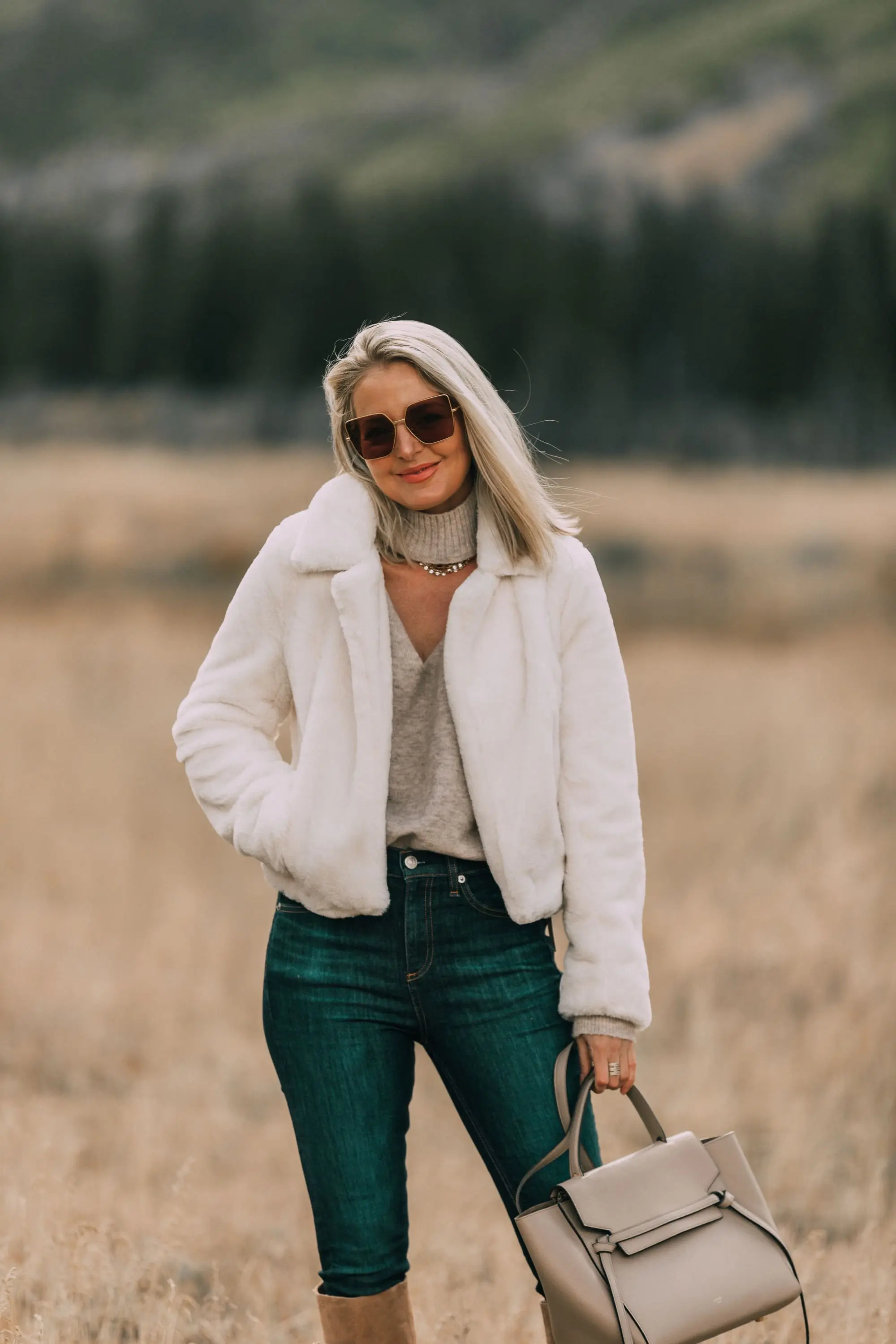 cozy faux fur jacket fashion blogger BLANKNYC white fur jacket outfit carrying celine handbag