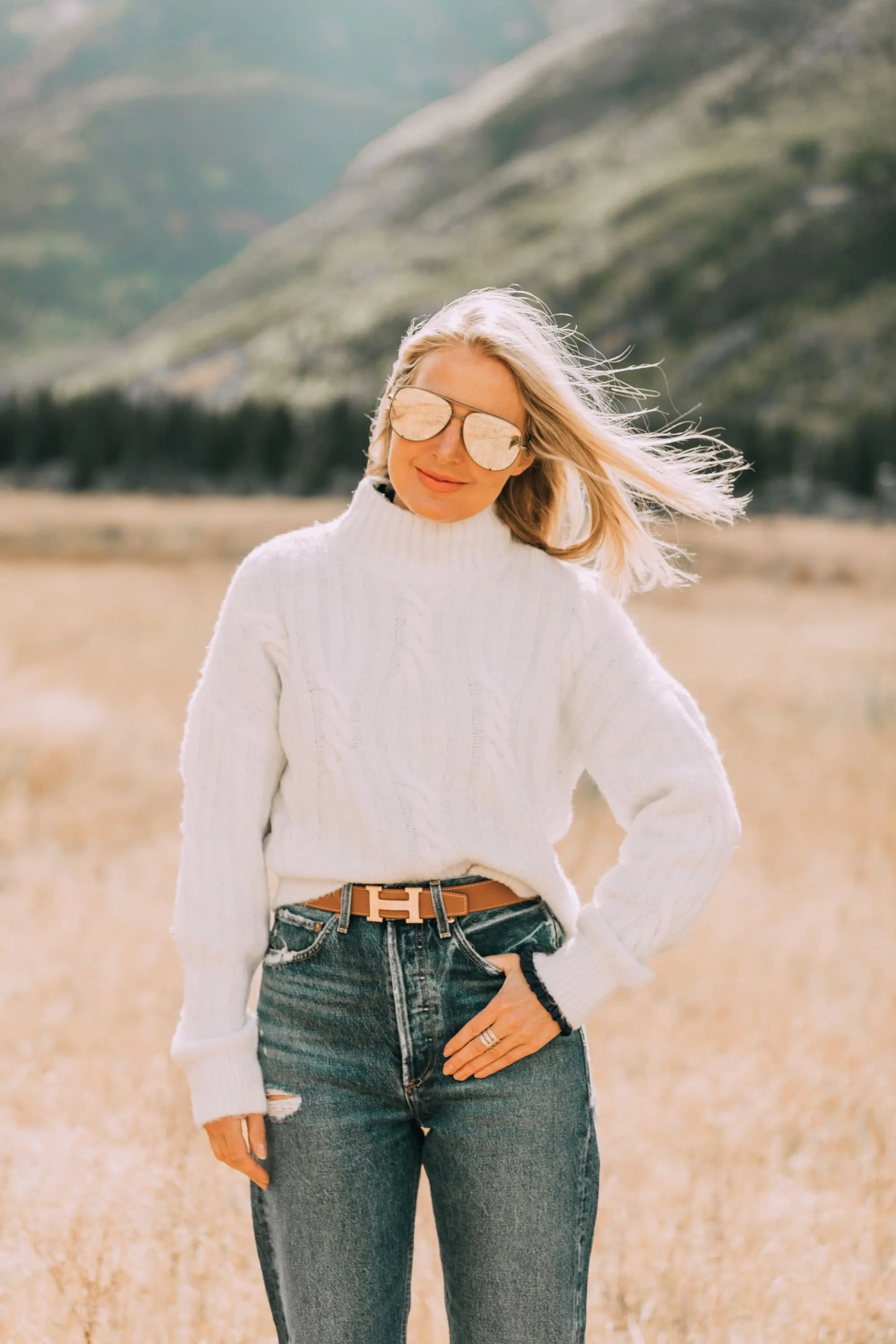 Baggy Jean trend, Fashion blogger wearing Agolde baggy oversized jeans Sam Edelman booties, white Express cable knit sweater, Staud moon bag in Telluride, CO