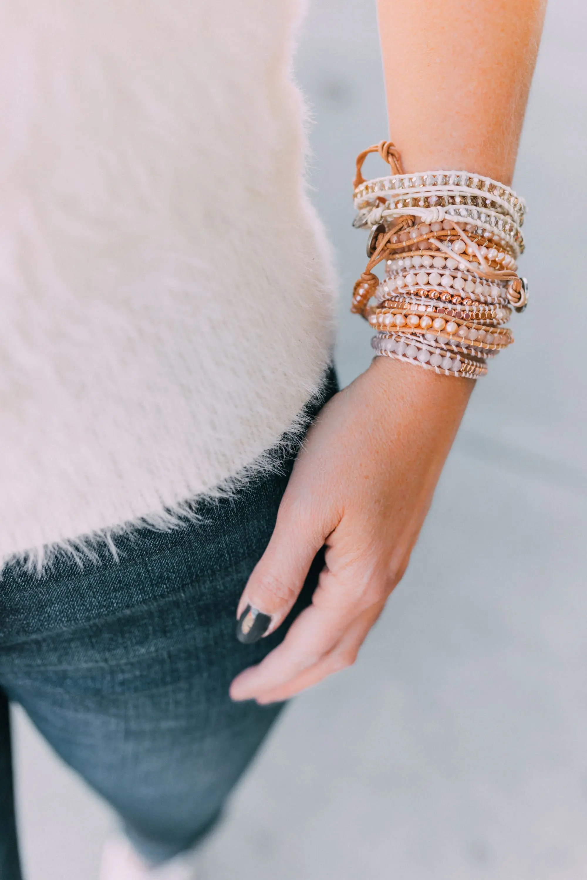 Fall Jewelry, Fashion blogger Erin Busbee of BusbeeStyle.com wearing three wrap bracelets by Victoria Emerson with dark wash skinny jeans, white fuzzy polo sweater, and Veja sneakers in Telluride, CO