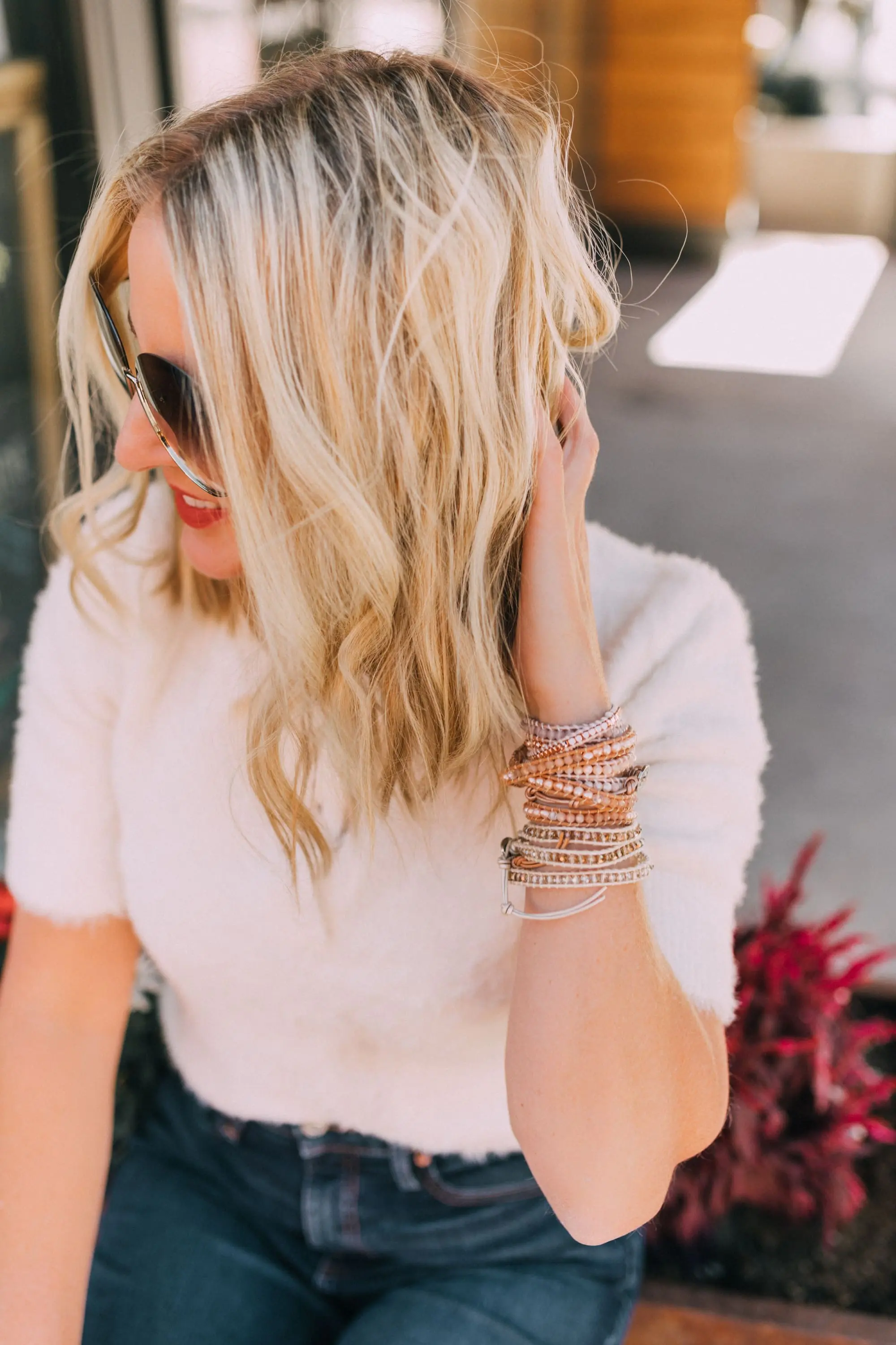 Fall Jewelry, Fashion blogger Erin Busbee of BusbeeStyle.com wearing three wrap bracelets by Victoria Emerson with dark wash skinny jeans, white fuzzy polo sweater, and Veja sneakers in Telluride, CO