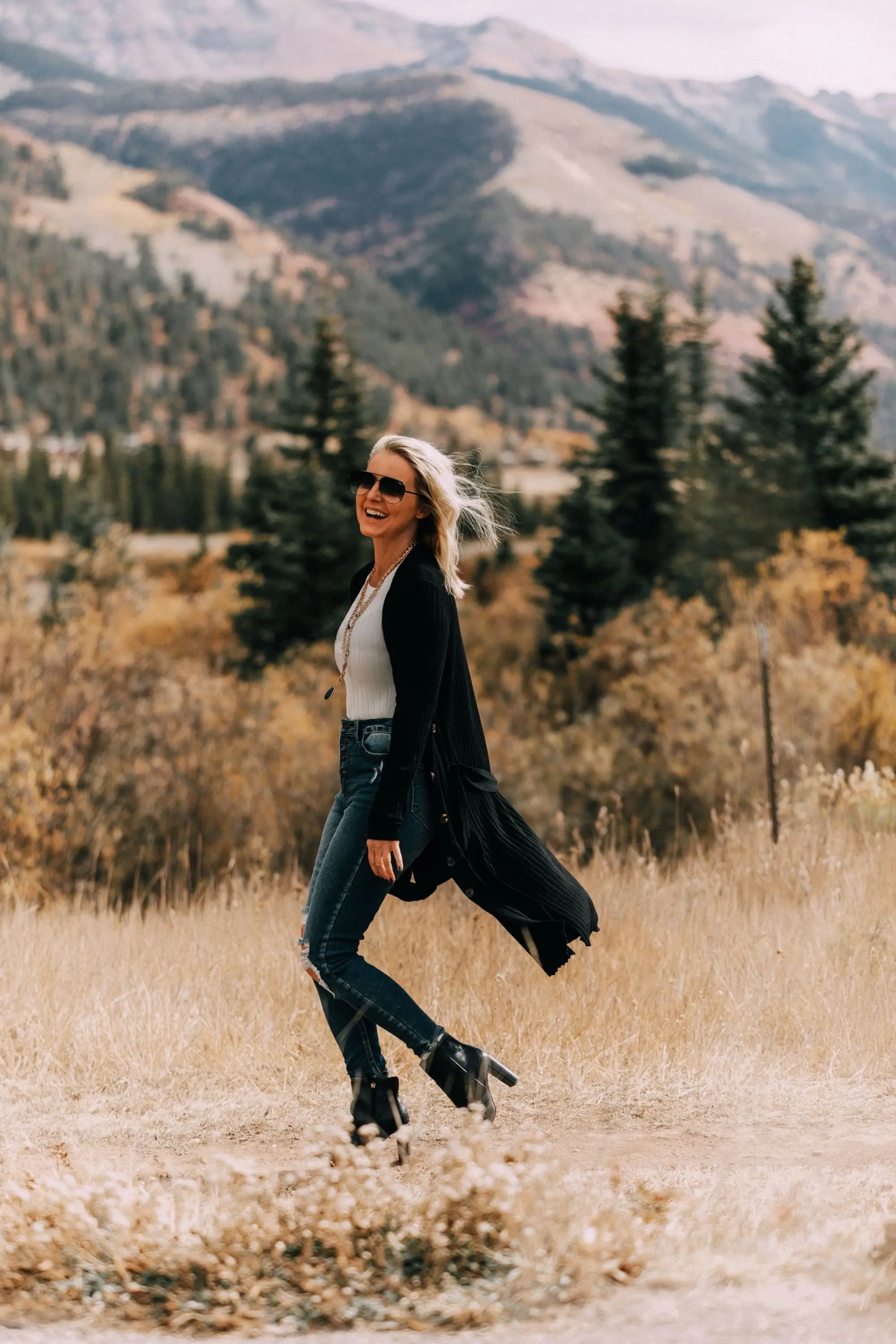 Long Cardigan outfit, Fashion blogger Busbee Style wearing Levi's ripped skinny jeans, Scoop Walmart snake embossed booties, white ribbed sweater, Walmart black ribbed long cardigan Telluride, CO