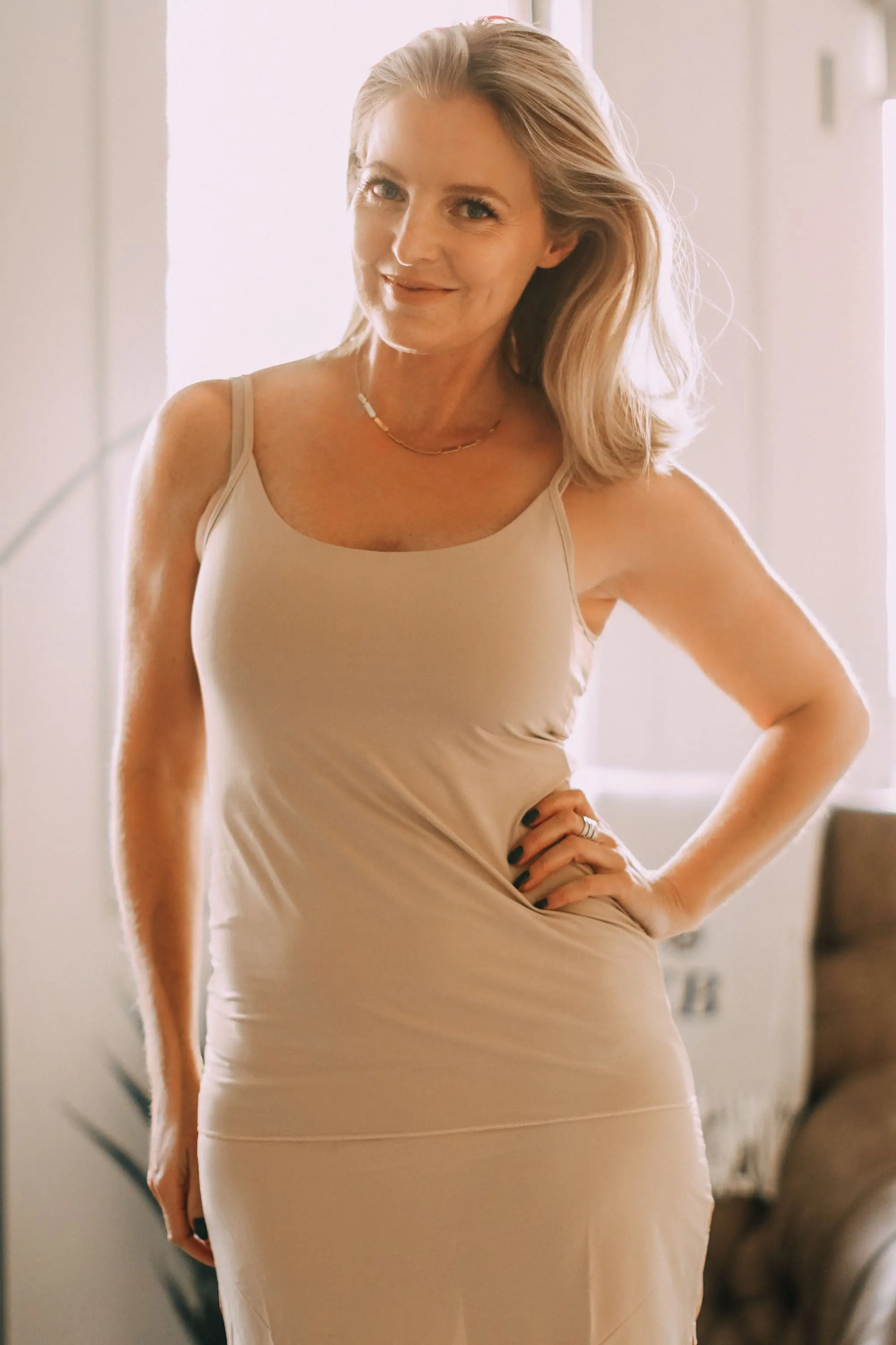 Best Slips, Fashion blogger Erin Busbee of BusbeeStyle.com wearing a nude skirt slip and camisole from Jockey in Telluride, CO