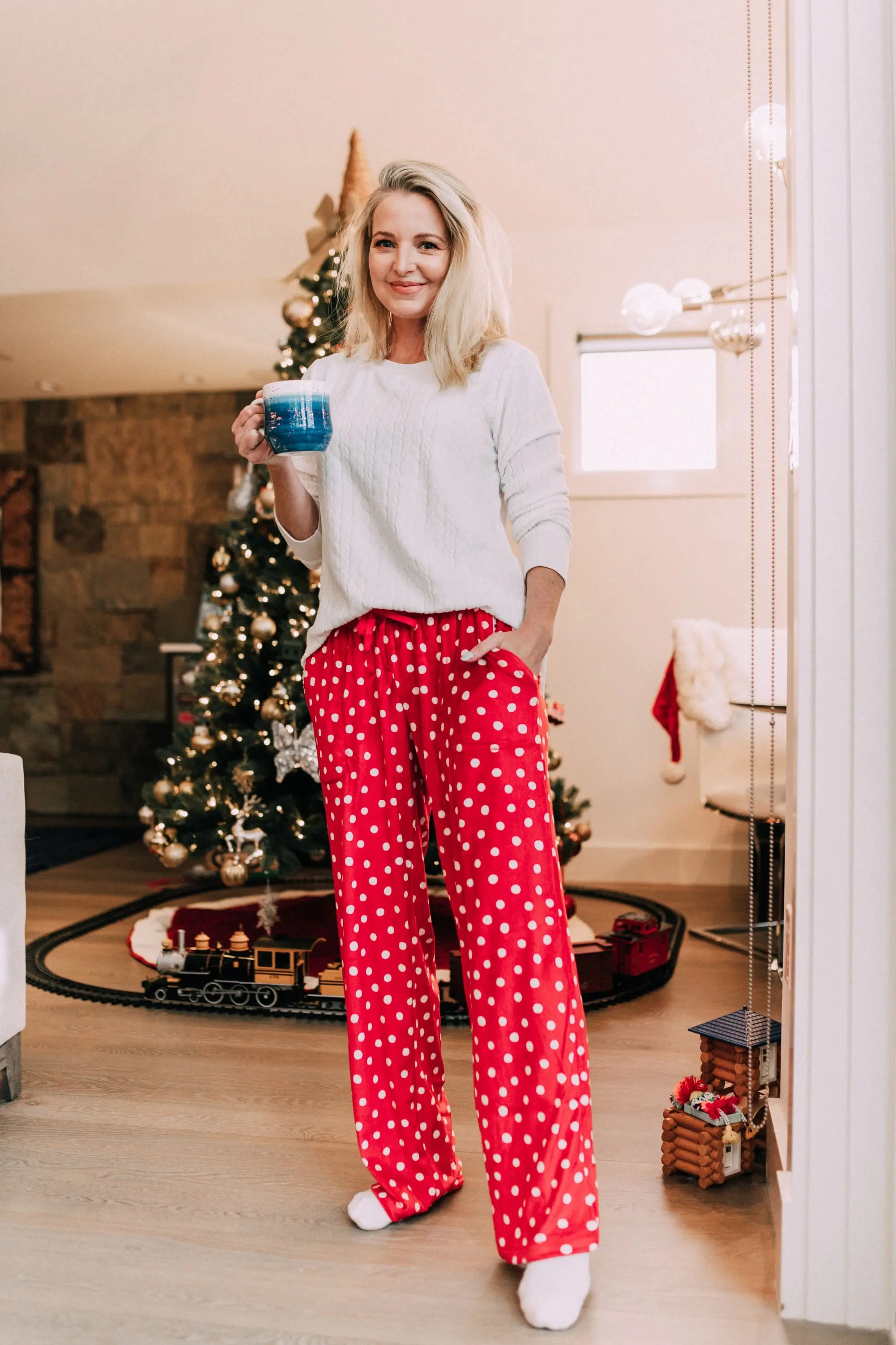 Holiday Traditions, Fashion blogger Erin Busbee of BusbeeStyle.com wearing red fleece polka dot pajama pants with a fleece cable knit pullover from Jockey in Telluride, CO