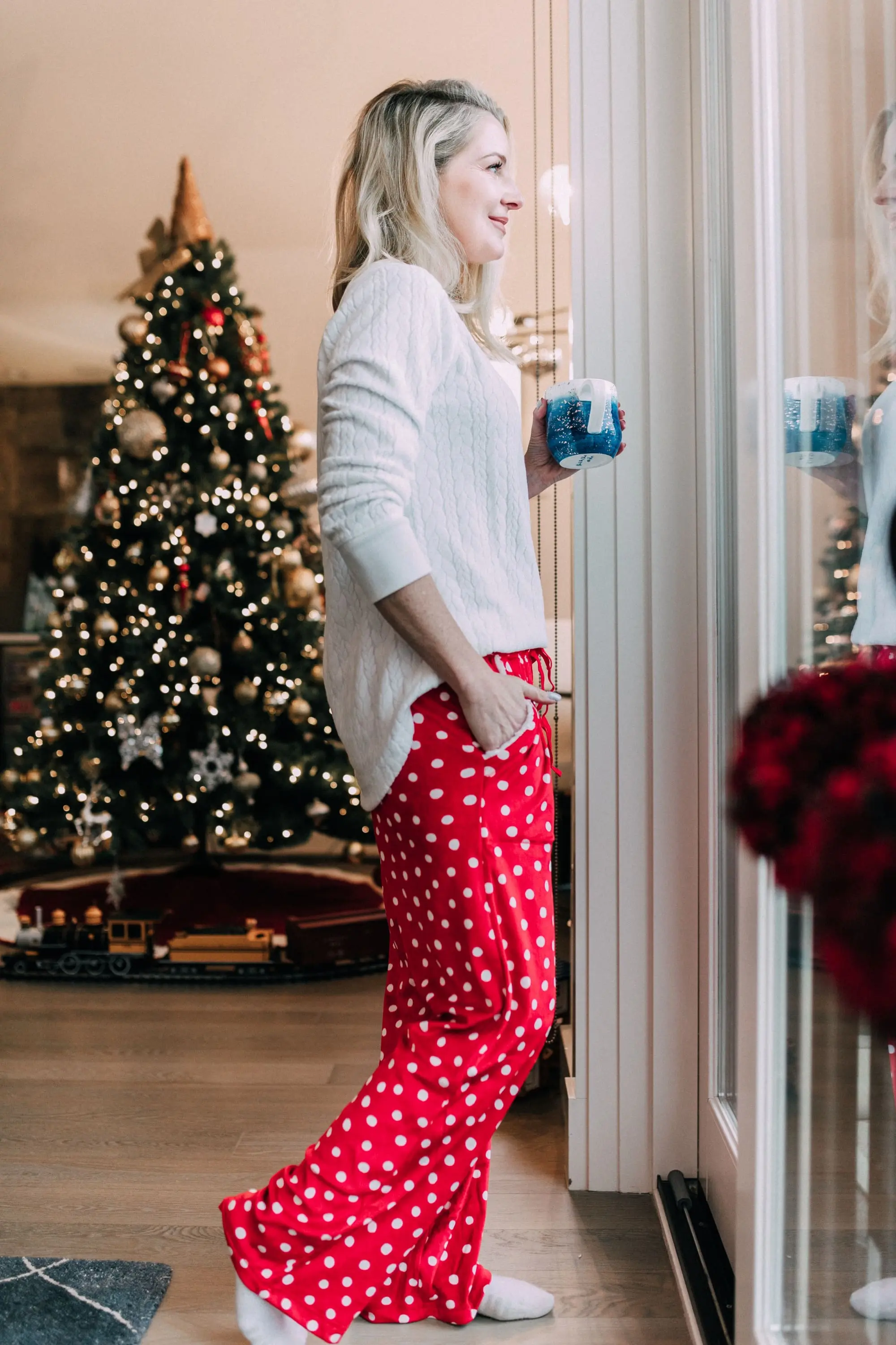 Holiday Traditions, Fashion blogger Erin Busbee of BusbeeStyle.com wearing red fleece polka dot pajama pants with a fleece cable knit pullover from Jockey in Telluride, CO