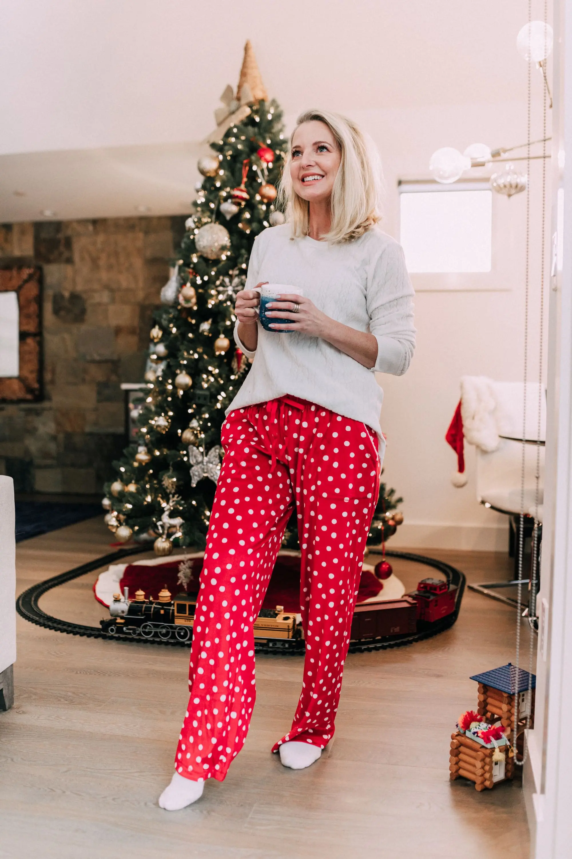 Holiday Traditions, Fashion blogger Erin Busbee of BusbeeStyle.com wearing red fleece polka dot pajama pants with a fleece cable knit pullover from Jockey in Telluride, CO