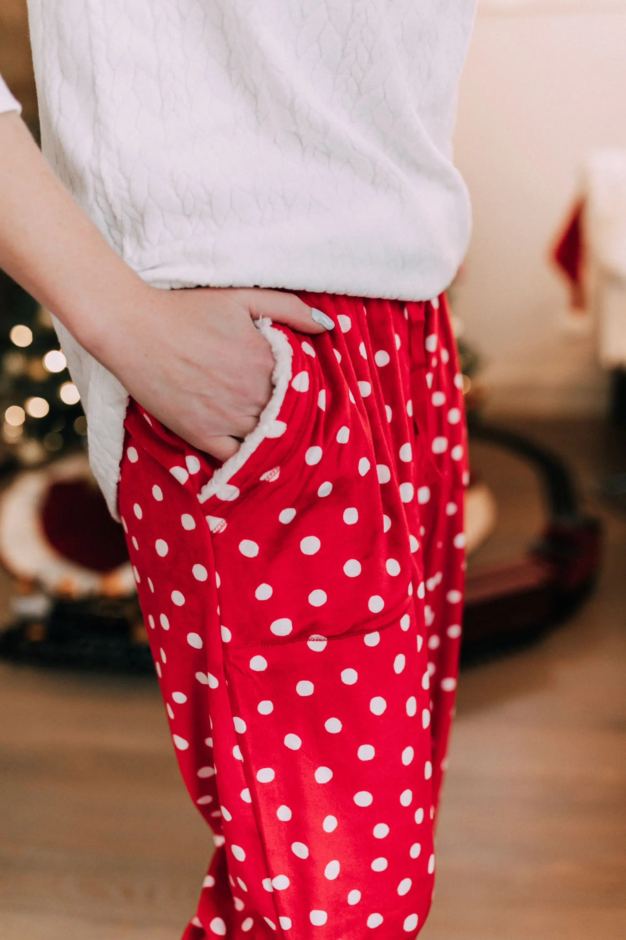 Holiday Traditions, Fashion blogger Erin Busbee of BusbeeStyle.com wearing red fleece polka dot pajama pants with a fleece cable knit pullover from Jockey in Telluride, CO