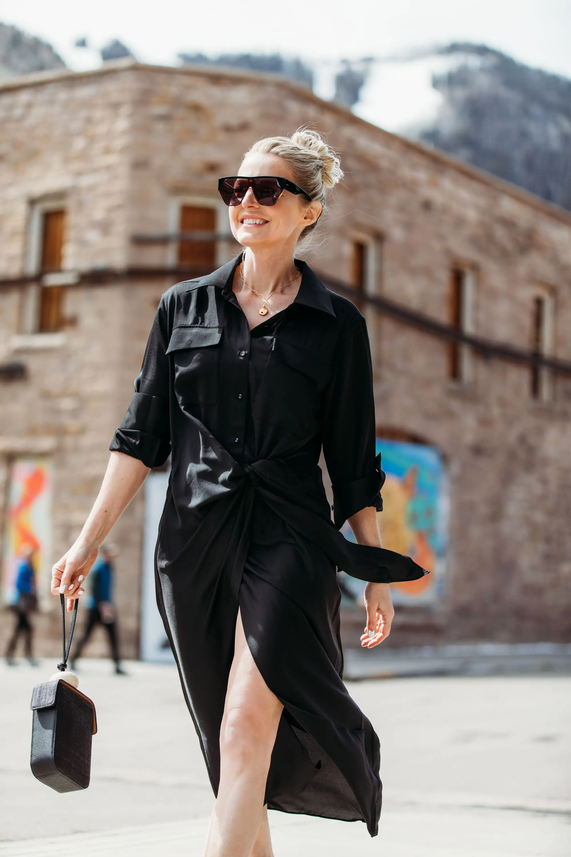 Spring Accessories, Fashion blogger Erin Busbee of BusbeeStyle.com wearing a black L'Academie shirt dress with Vince Camuto shoes and a black Vince Camuto bracelet bag walking in Telluride, Colorado