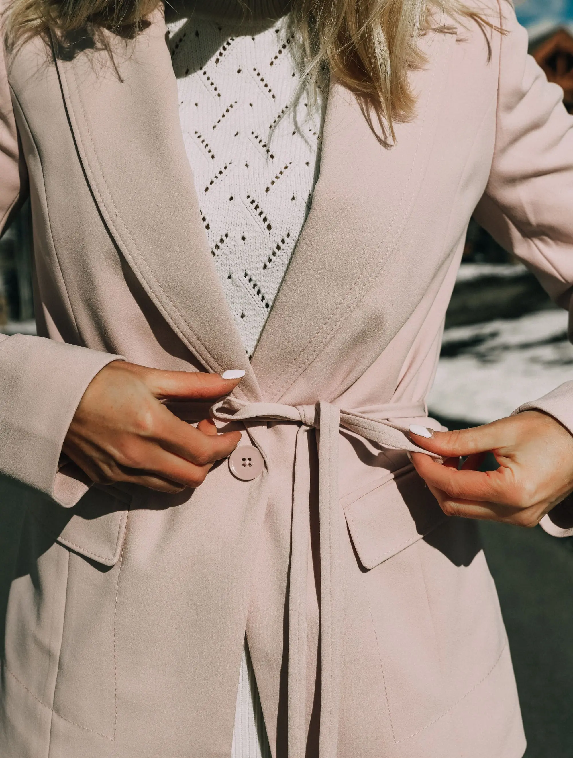 Pink Office Outfit, Fashion blogger Erin Busbee of BusbeeStyle.com wearing a pink power suit from White House Black Market, including a pink belted blazer, pink soft stretch pants, white puff sleeve sweater dress, pink pumps, pink earrings, and aviator sunglasses in Telluride, Colorado
