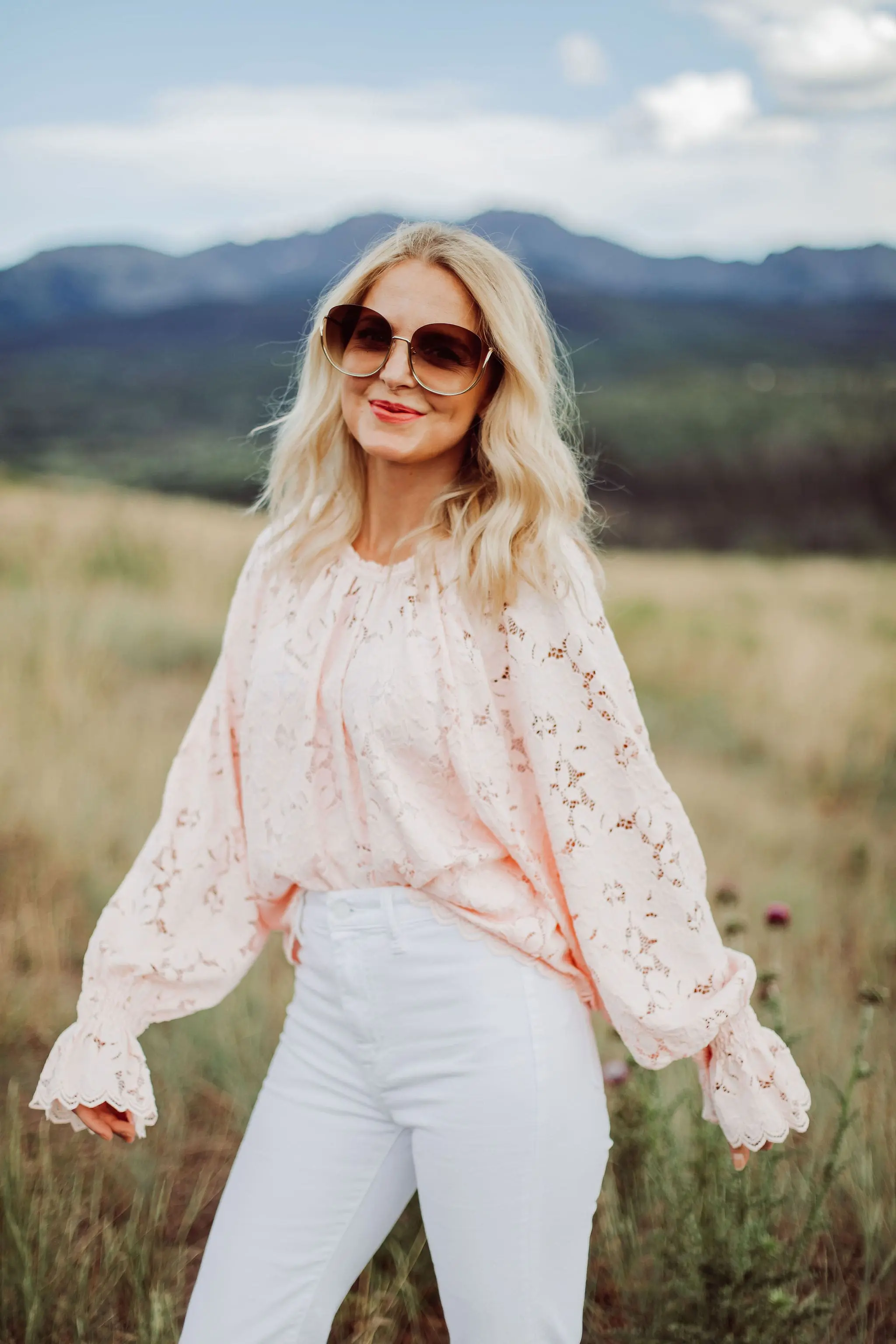 White Jeans Over 40, Fashion blogger Erin Busbee of Busbee Style wearing white 7 For All Mankind split hem jeans with See by Chloe espadrille wedges and pink lace long sleeve Free People top in Telluride, Colorado