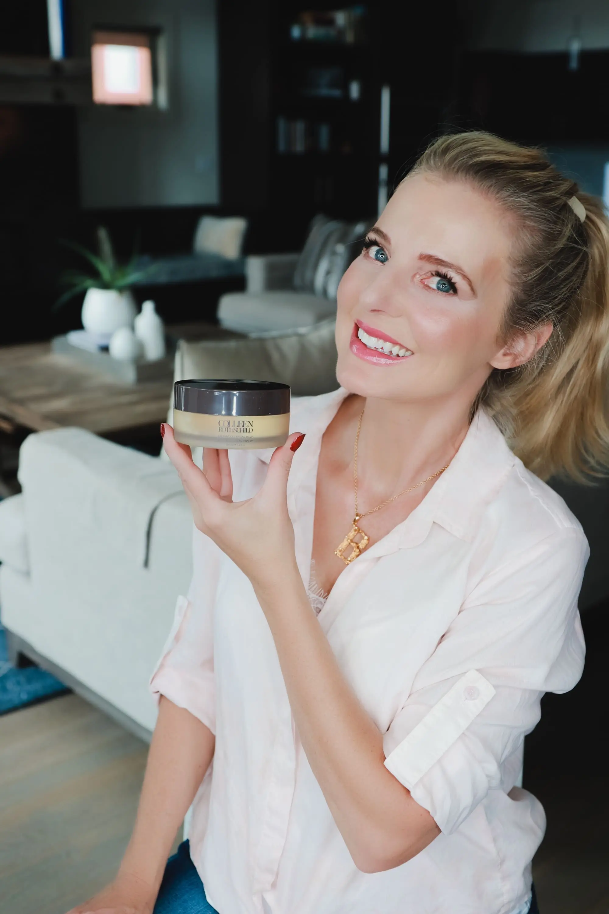 Favorite Skincare Brand, Erin Busbee of Busbee Style holding the Colleen Rothschild Radiant Cleansing Balm in her home in Telluride, Colorado