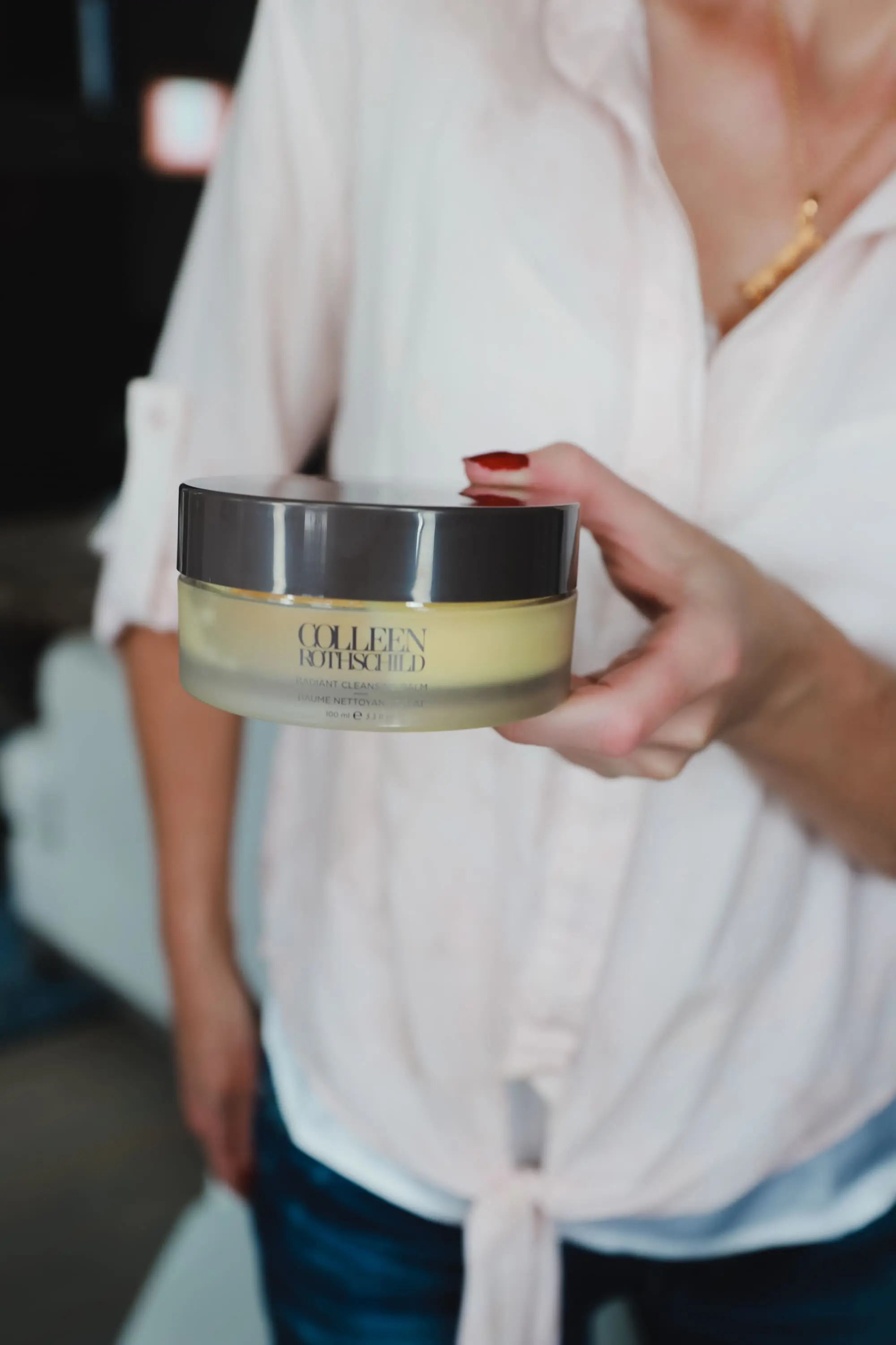 Favorite Skincare Brand, Erin Busbee of Busbee Style holding the Colleen Rothschild Radiant Cleansing Balm in her home in Telluride, Colorado