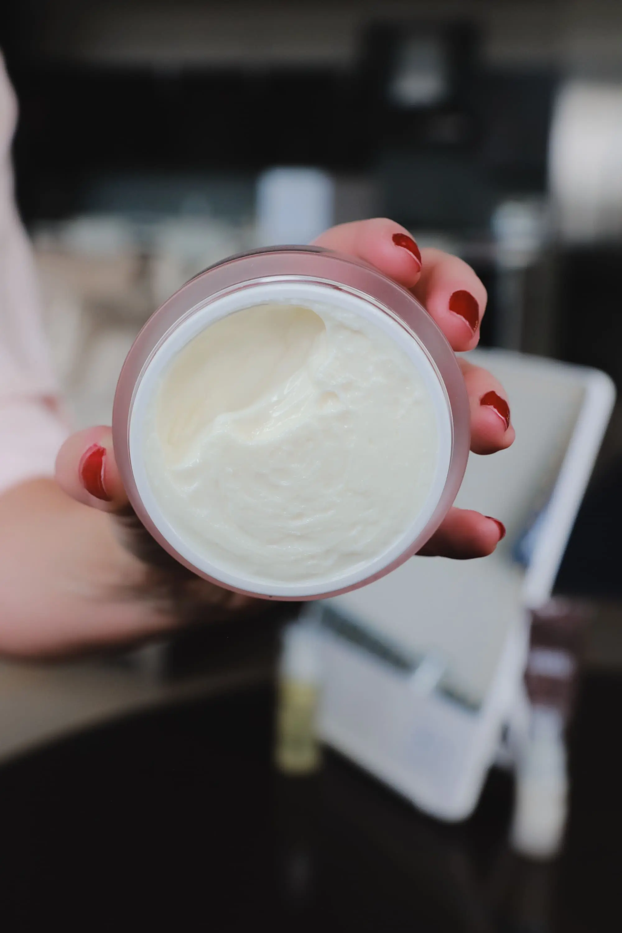 Favorite Skincare Brand, Erin Busbee of Busbee Style holding the Colleen Rothschild Extreme Recovery Cream in her home in Telluride, Colorado