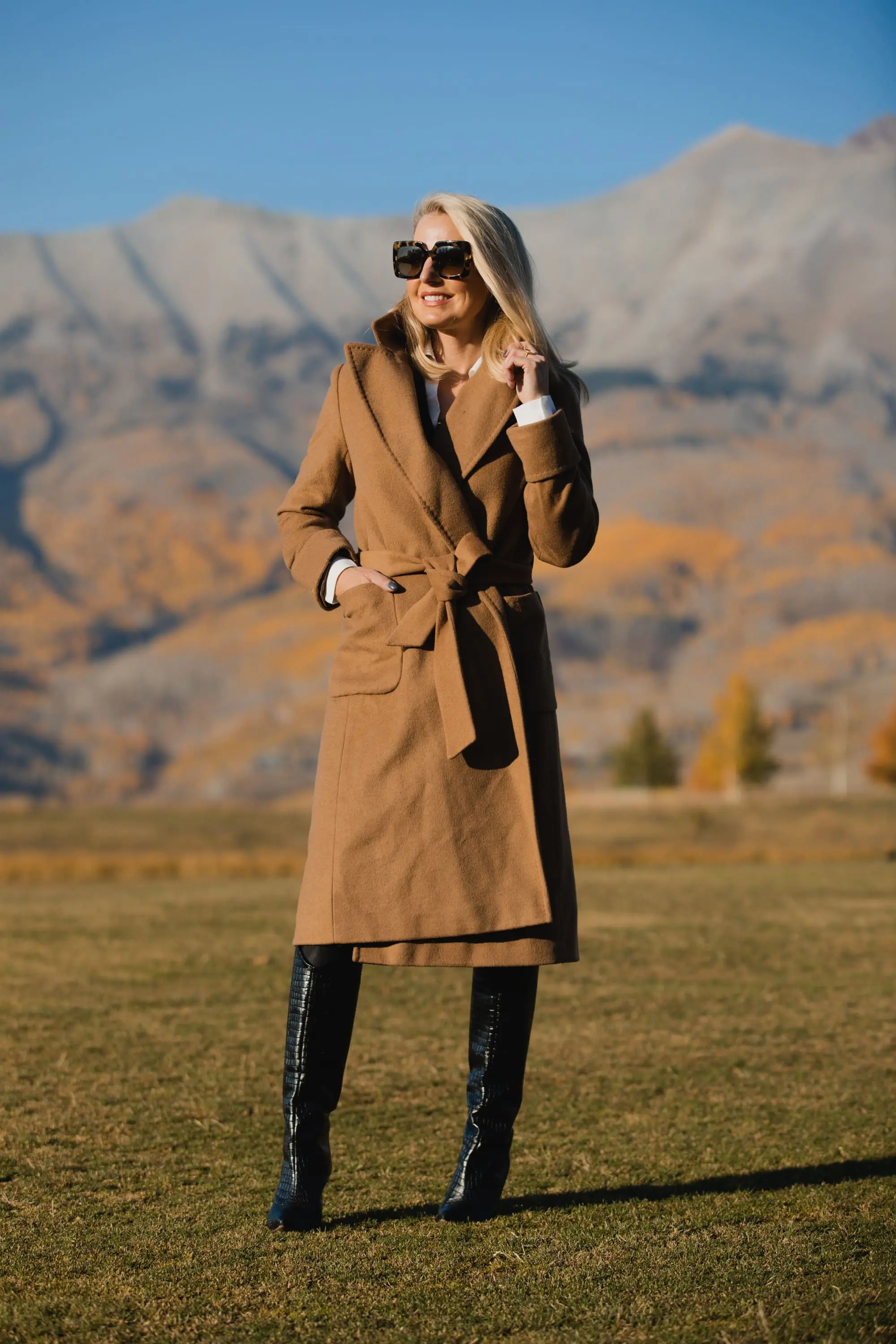 Perfect Camel Coat, Erin Busbee of Busbee Style wearing a Ralph Lauren camel wool wrap coat over a brown brochu walker layered sweater, spanc faux leather leggings, and shutz black croc embossed leggings in Telluride, Colorado