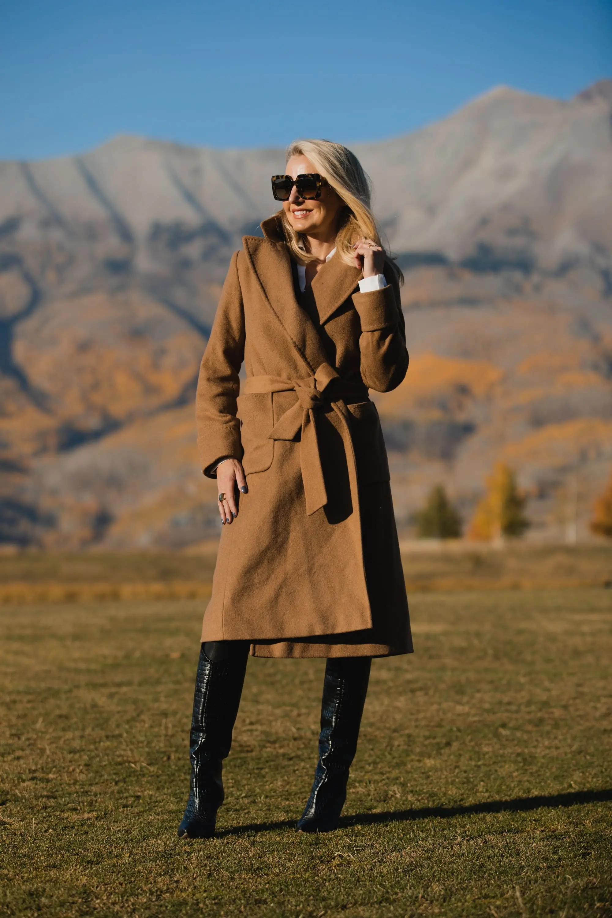 Perfect Camel Coat, Erin Busbee of Busbee Style wearing a Ralph Lauren camel wool wrap coat over a brown brochu walker layered sweater, spanc faux leather leggings, and shutz black croc embossed leggings in Telluride, Colorado