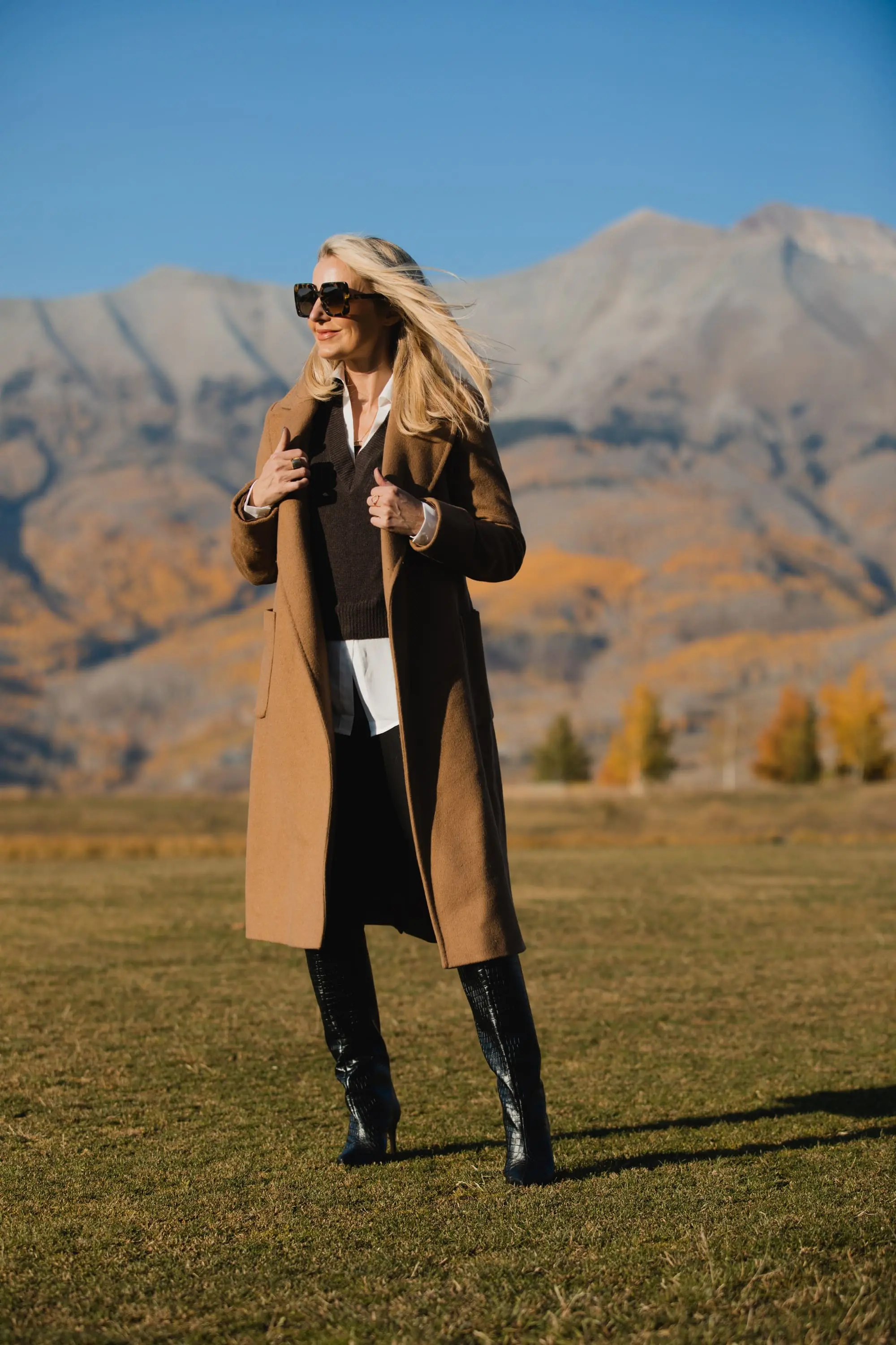 Perfect Camel Coat, Erin Busbee of Busbee Style wearing a Ralph Lauren camel wool wrap coat over a brown brochu walker layered sweater, spanc faux leather leggings, and shutz black croc embossed leggings in Telluride, Colorado