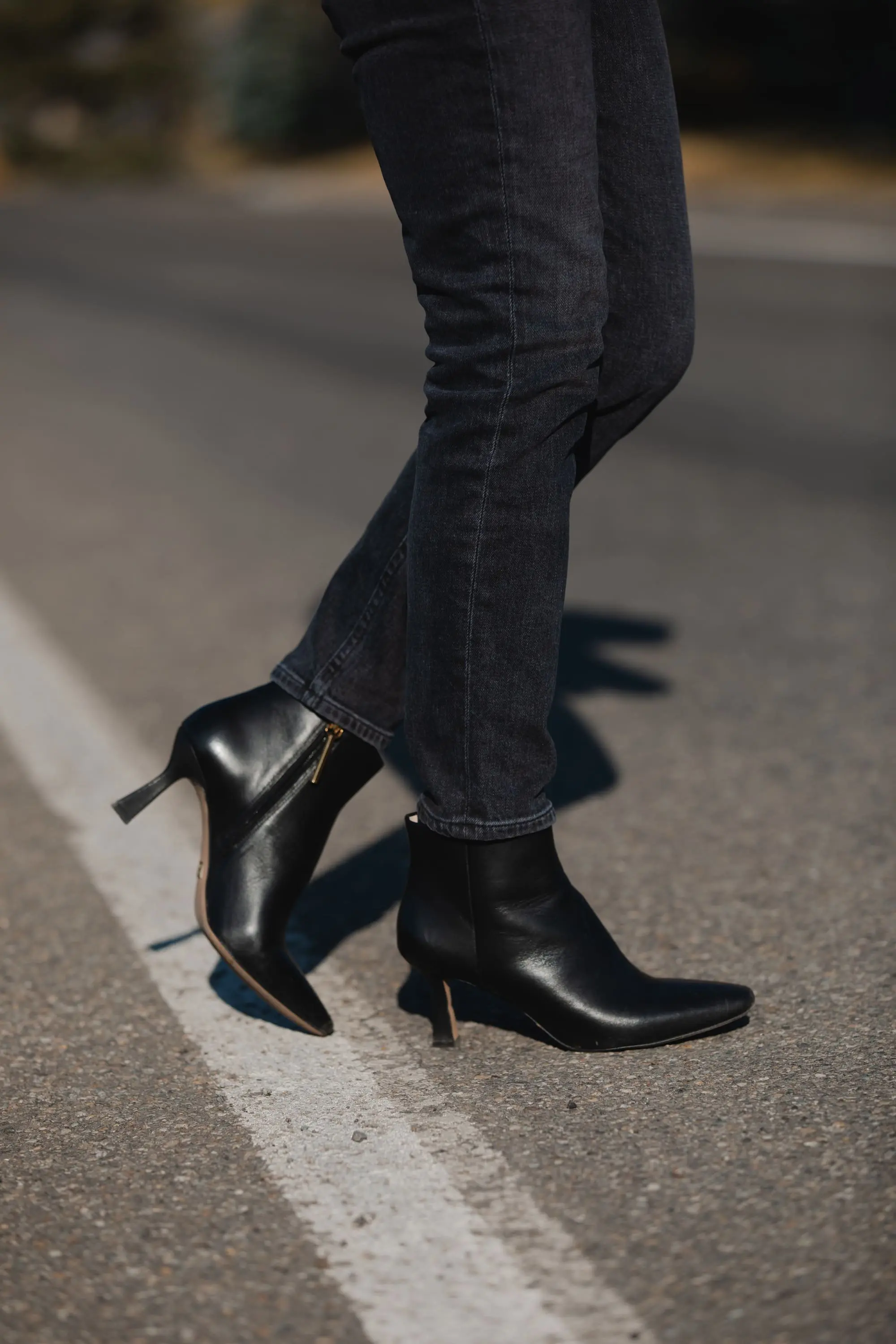 Favorite Fall Jackets, Erin Busbee of Busbee Style holding a black faux leather blazer by Theory and wearing dark gray wash Agolde Nico jeans, black Louise et Cie booties, and Rails camo cardigan sweater in Telluride, Colorado