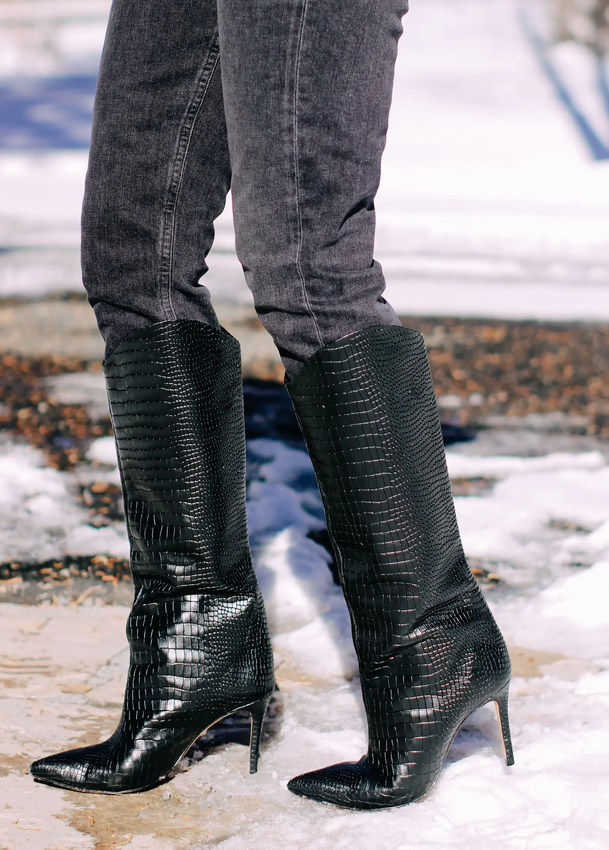 Thoughtful Gifts, Erin Busbee of Busbee Style wearing a black puff sleeve cashmere sweater by AQUA, gray wash Agolde jeans, black Sorel boots, and a diamond star necklace by Marc & Marcella from Bloomingdale's in Telluride, Colorado